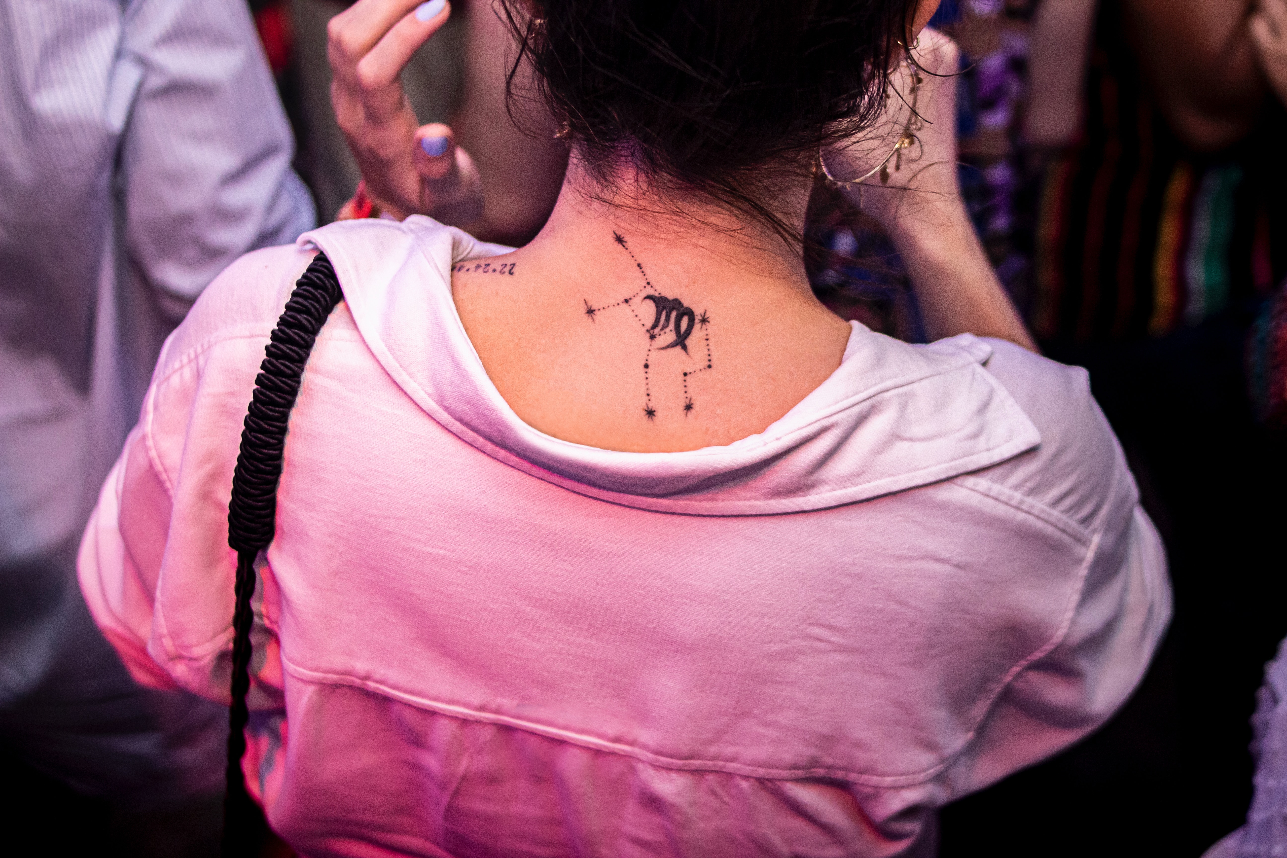 A woman with a Virgo sign on her back. | Source: Unsplash