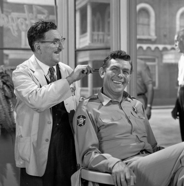 Andy Griffith as Sheriff Andy Taylor and Howard McNear as barber Floyd Lawson in a scene from the television series "The Andy Griffith Show," circa 1965. | Photo: Getty Images