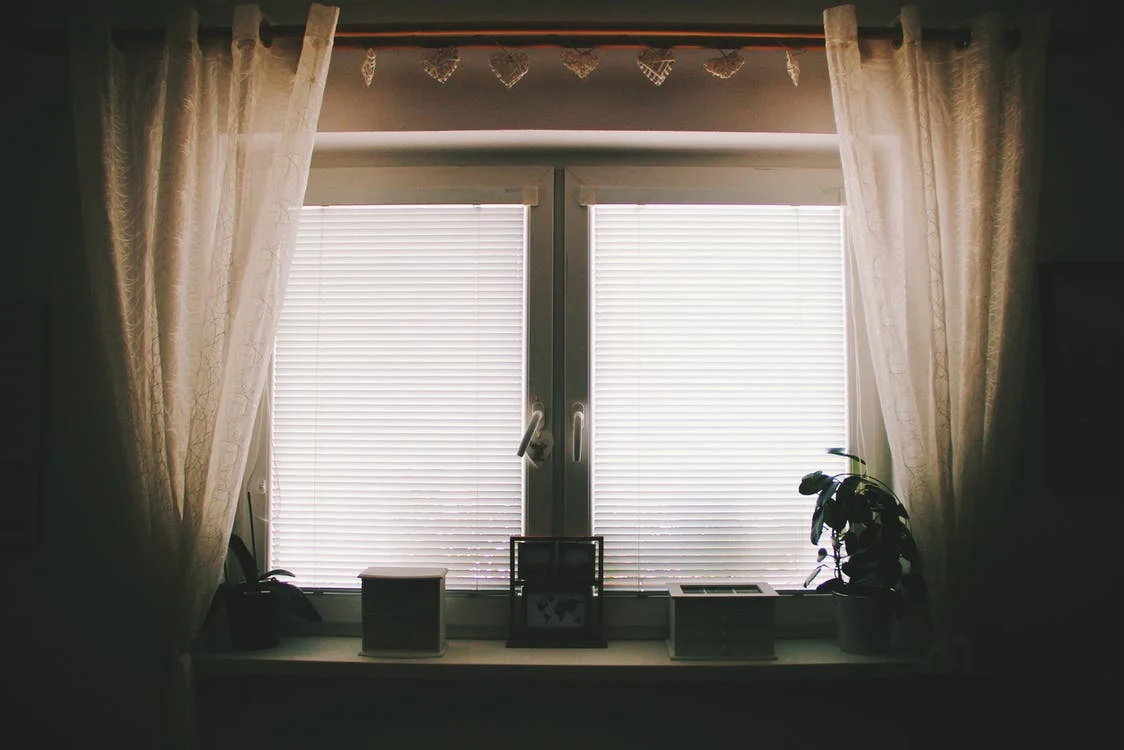 She peeked at them briefly through the curtains but shrugged, hoping they wouldn't come back. | Source: Pexels