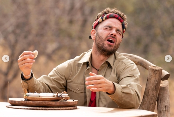 Adam Thomas appeared visibly overwhelmed during a jungle meal in a post shared on 23 April 2026, reflecting the emotional toll of his "I'm a Celebrity" experience. | Source: Instagram/adamthomas21