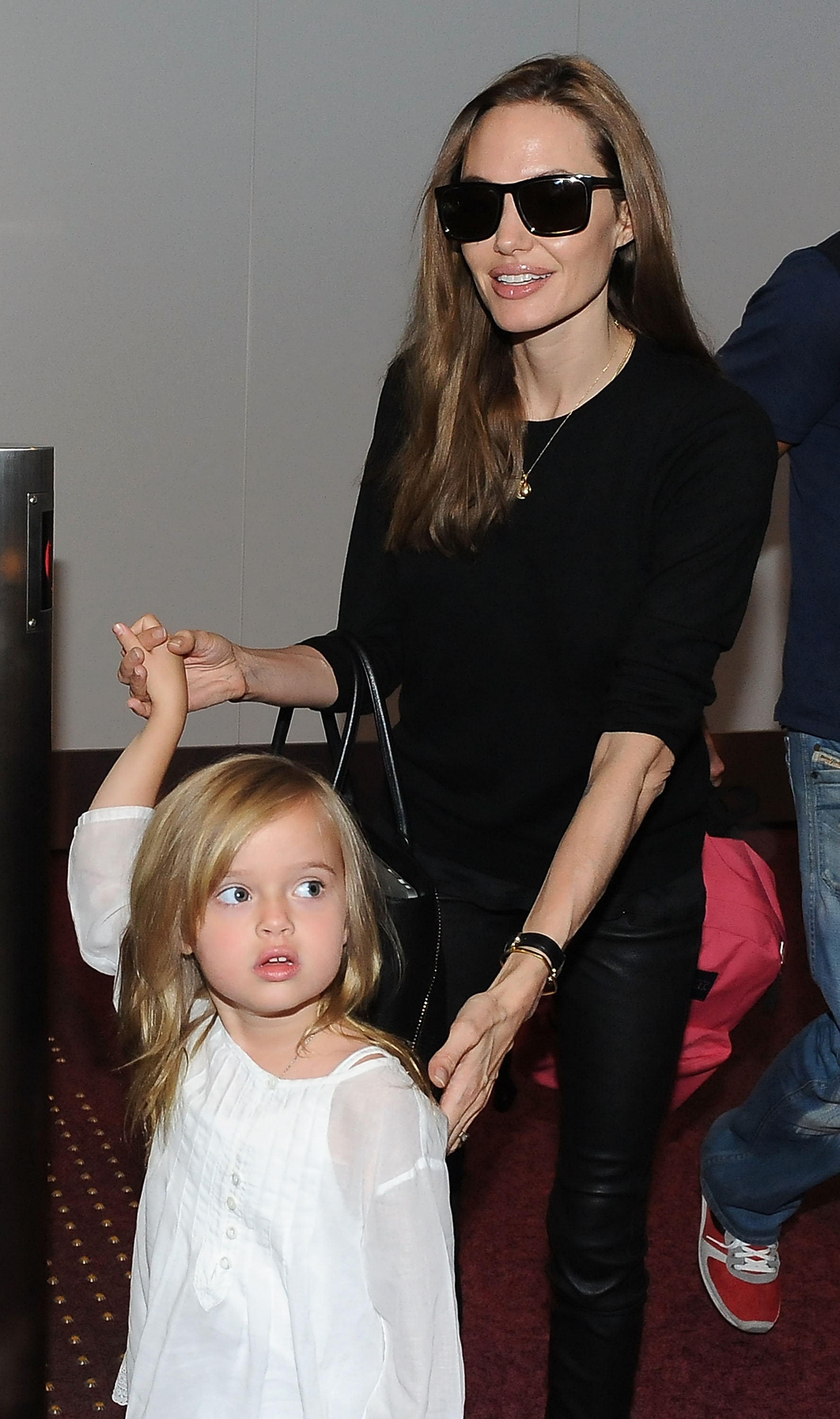 Angelina Jolie and Vivienne Jolie-Pitt arrive at Tokyo International Airport on July 28, 2013 in Tokyo, Japan. | Source: Getty Images