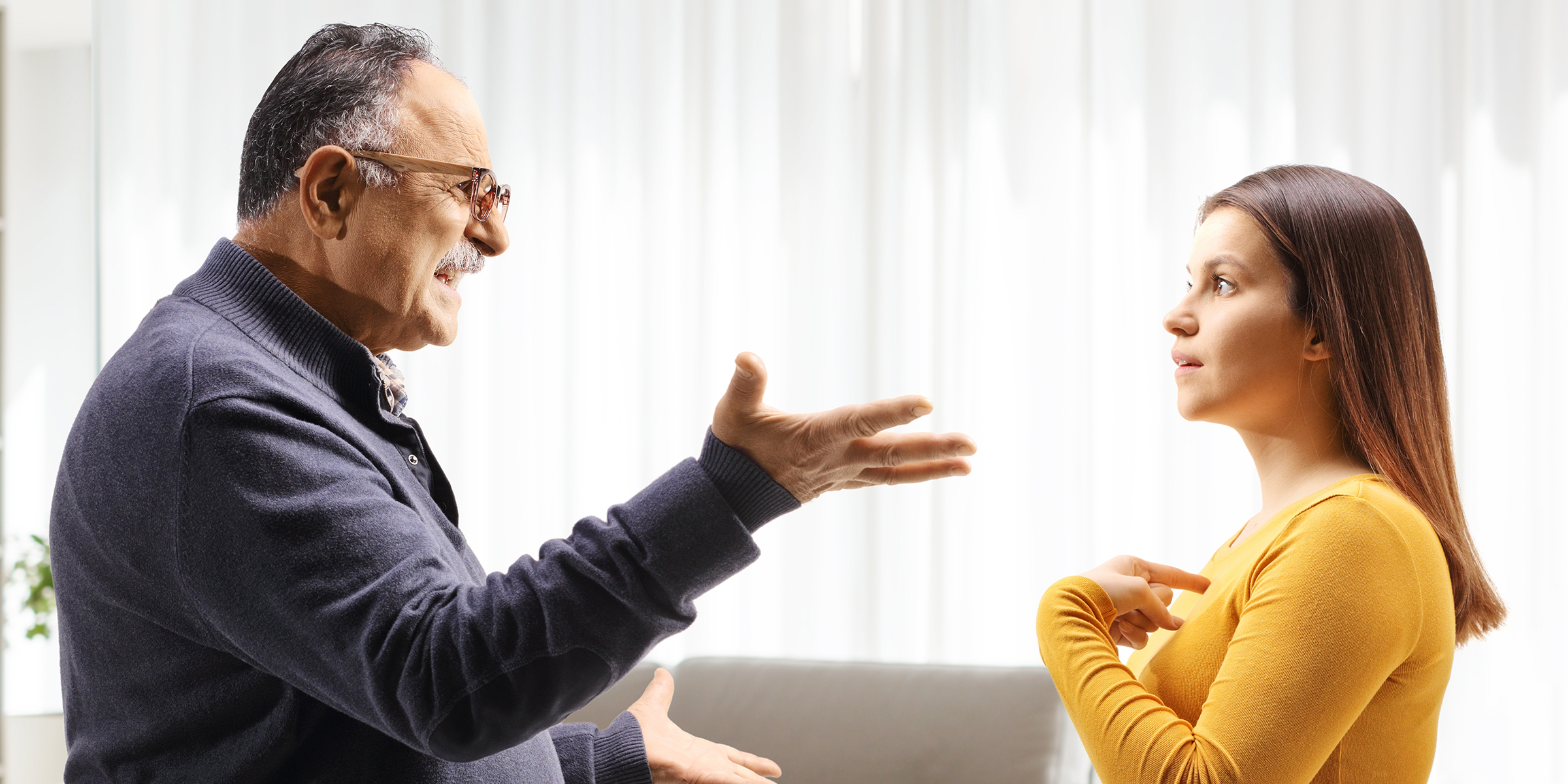 Angry man arguing with young woman | Source: Shutterstock