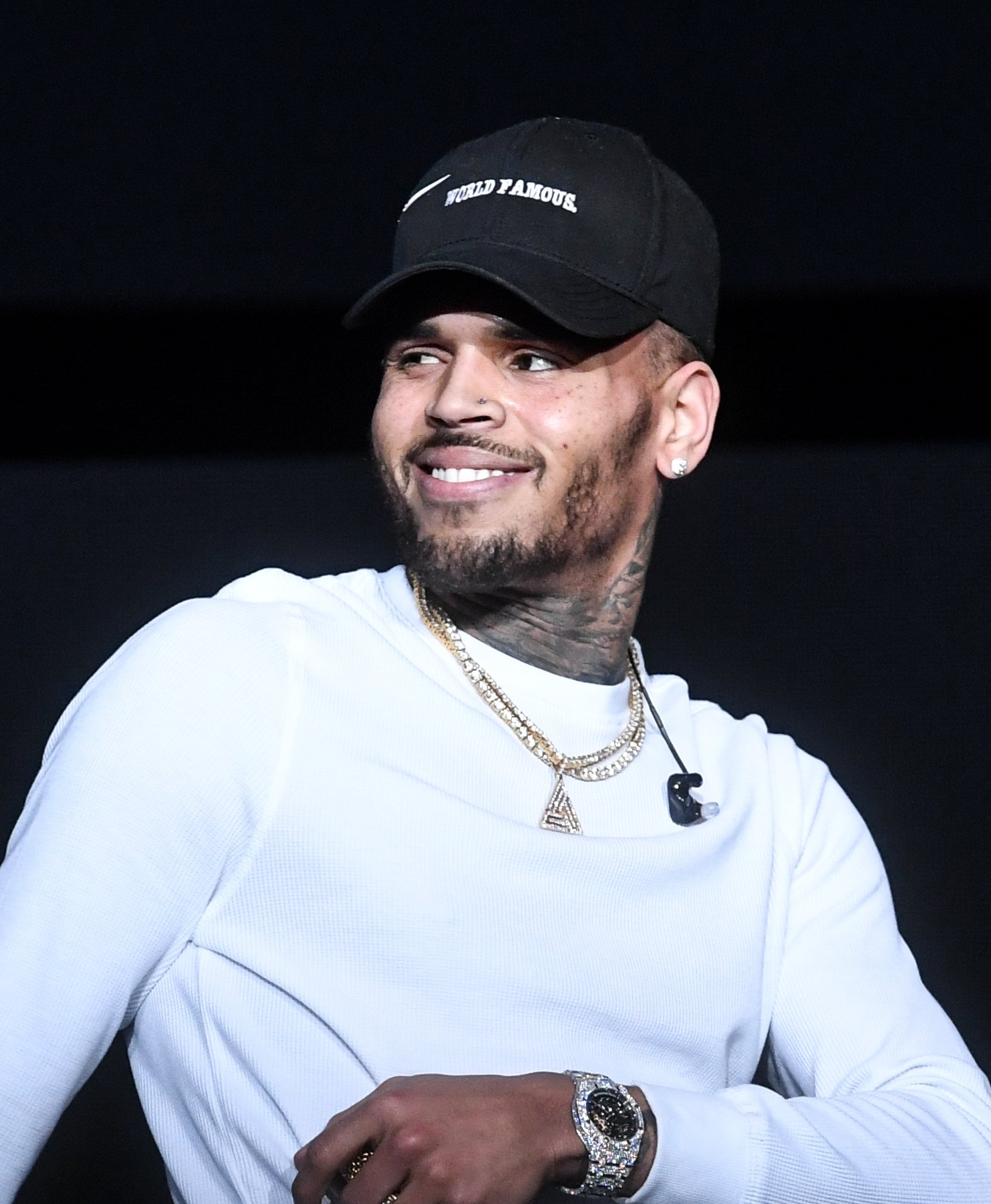 Chris Brown smiles at his audience at a concert in Atlanta in December 2017. | Photo: Getty Images