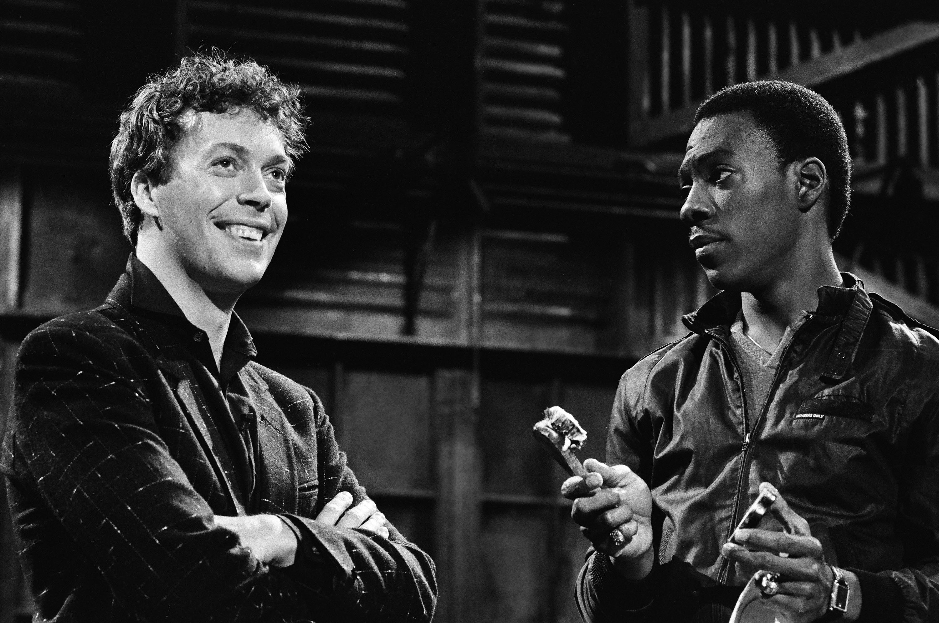 Tim Curry and Eddie Murphy during the monologue on "Saturday Night Live" on December 5, 1981. | Source: Getty Images
