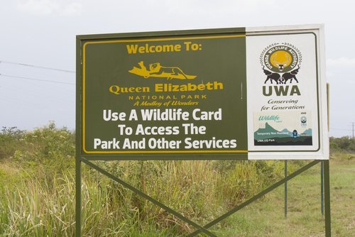 Billboard with welcome message to Queen Elizabeth National Park, Uganda, Africa. | Source: Shutterstock.