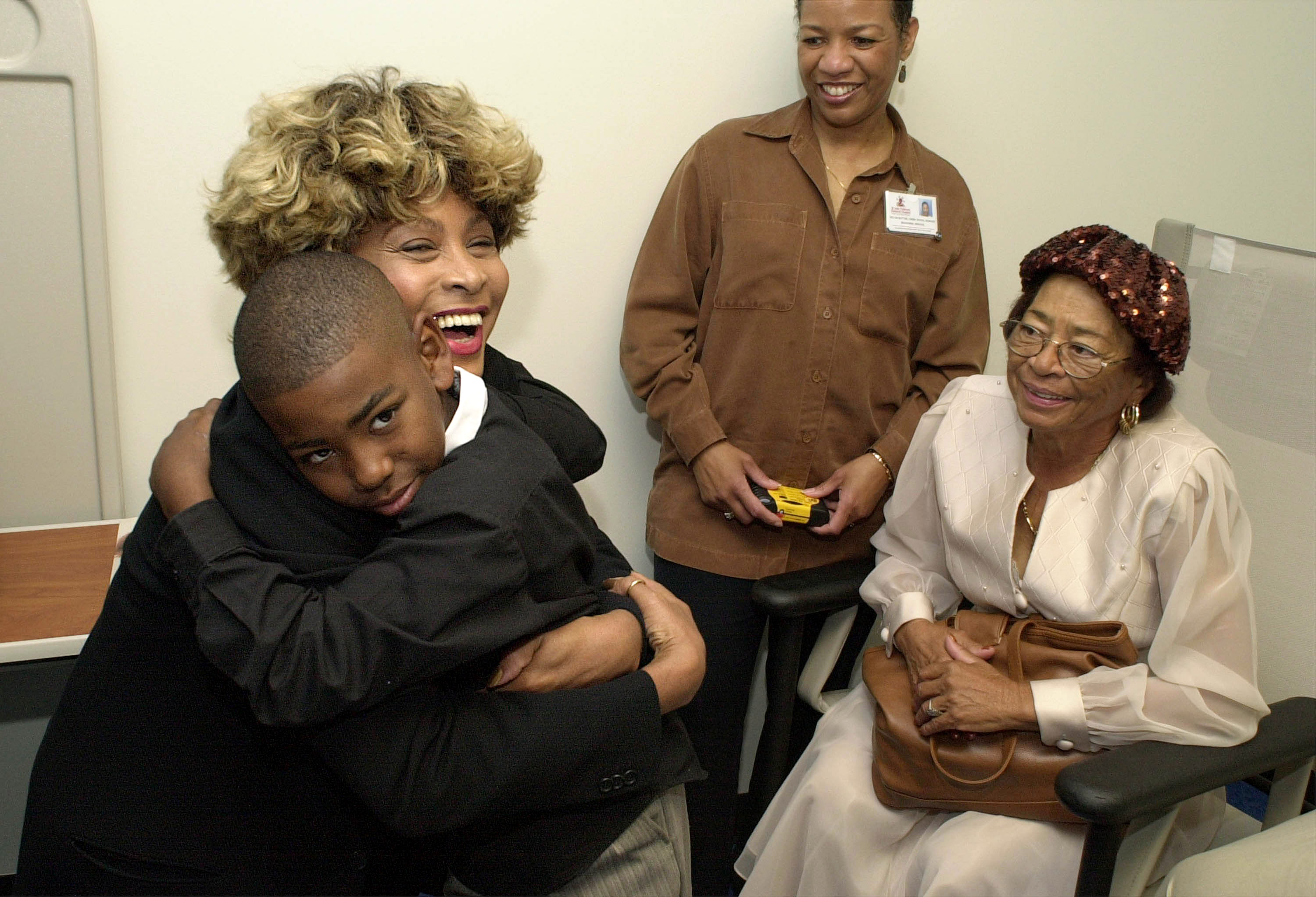 Tina Turner hugs Shawn Bell, 10, at St. Jude's Children's Research Hospital on Friday, Oct. 20, 2000 in Memphis, Tennessee. | Source: Getty Images