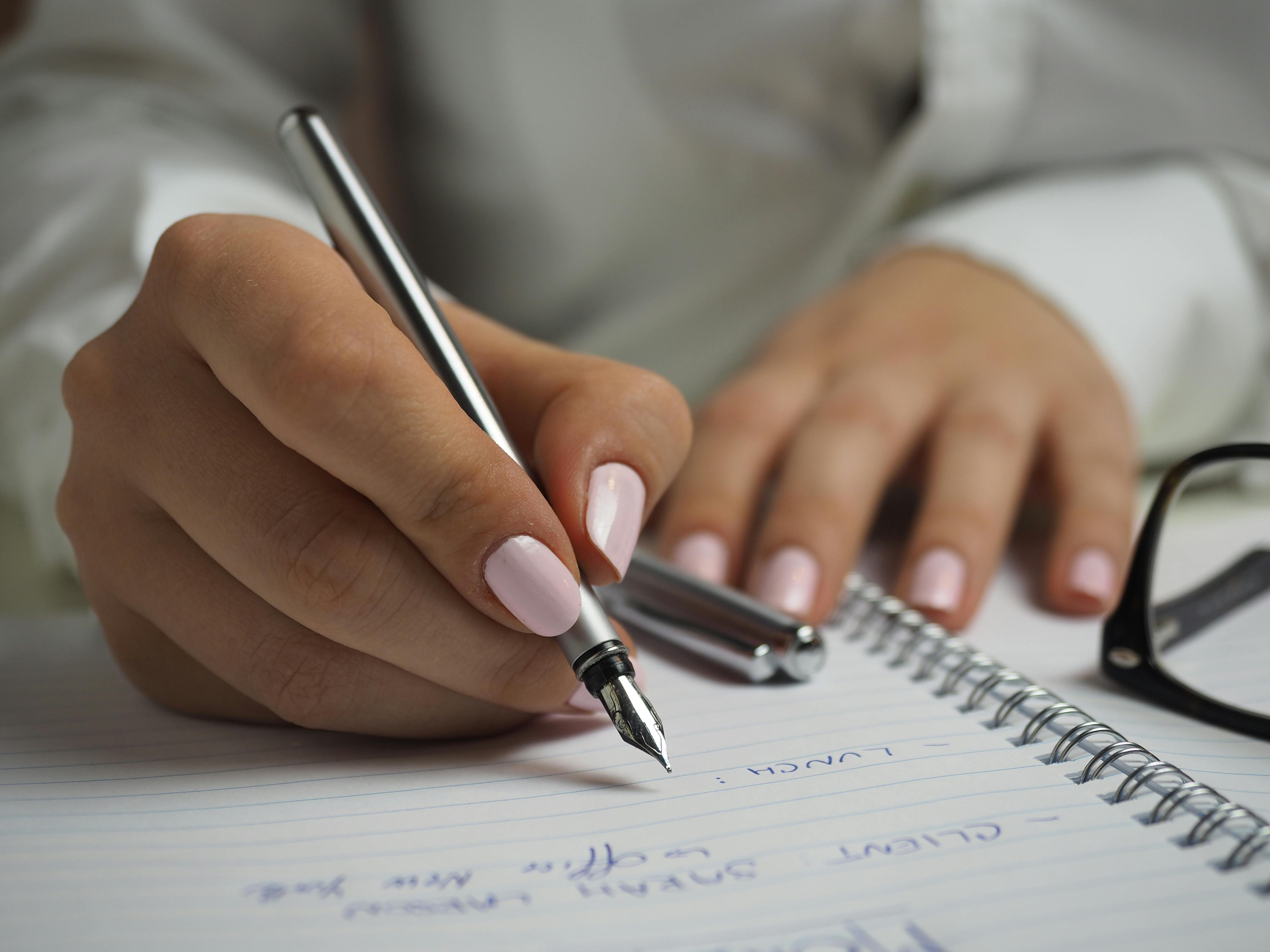 A woman making a list | Source: Pexels