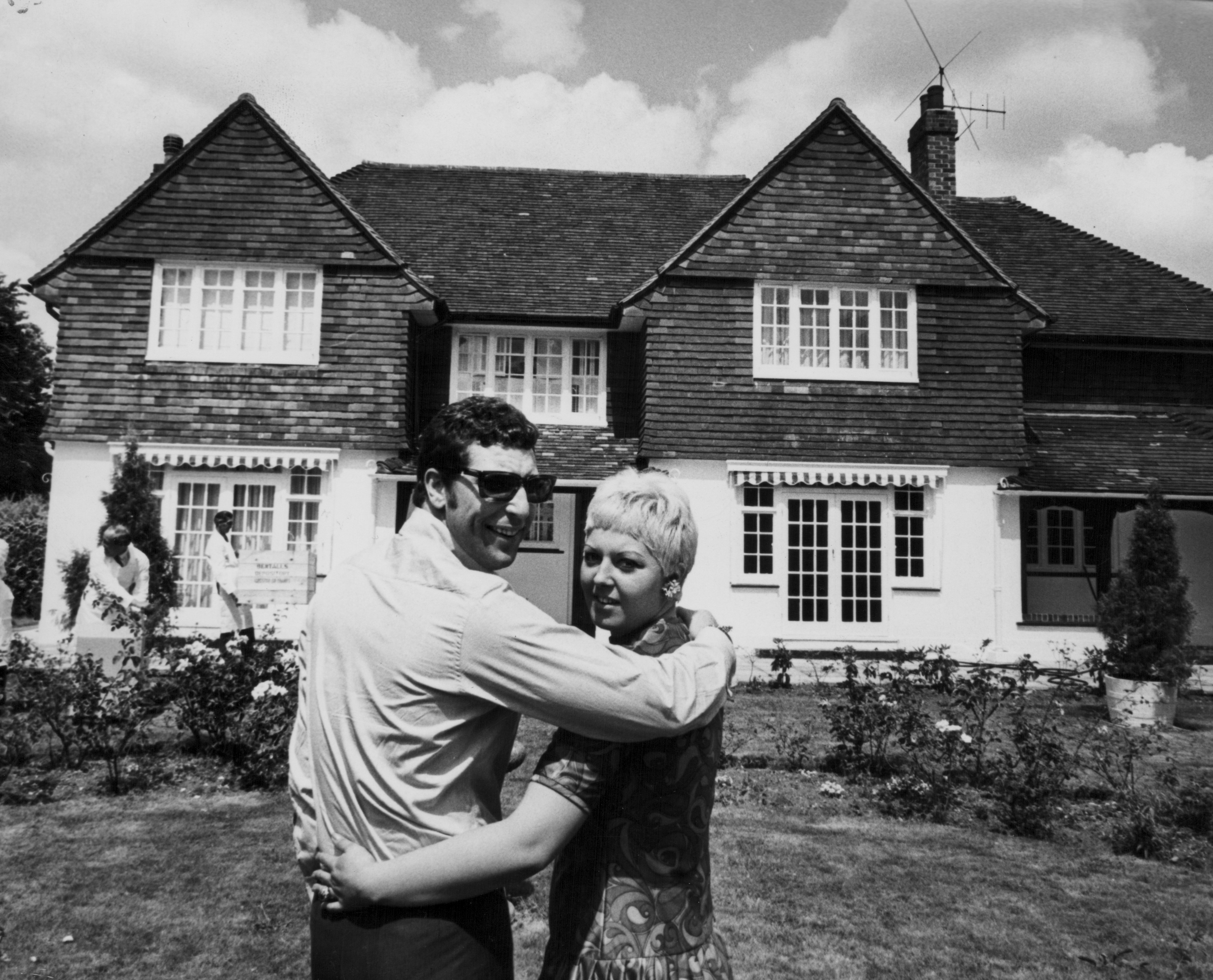 Tom Jones and Melinda Trenchard, posing outside their home on July 20, 1967 in Glamorgan, Wales. / Source: Getty Images