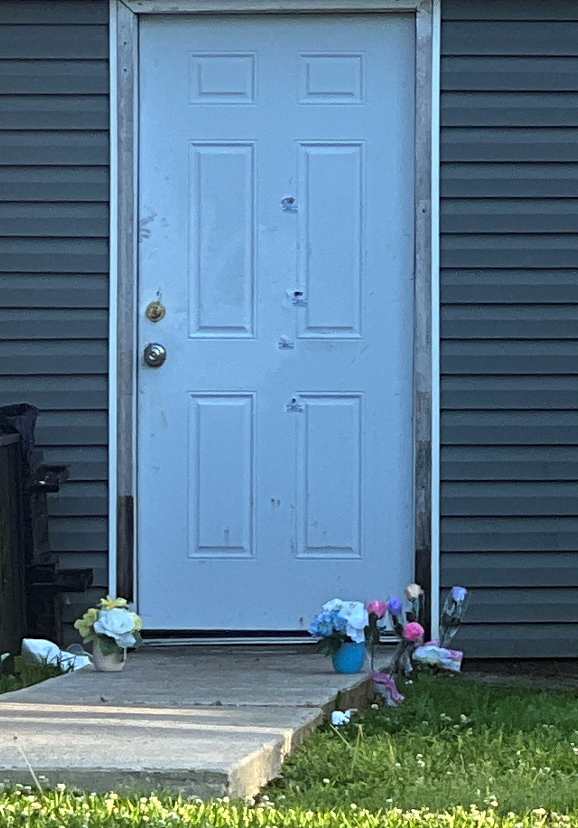 Bullet holes are seen on a door of the house where a mass shooting took place in Shreveport, Louisiana, on April 19, 2026. | Source: Getty Images