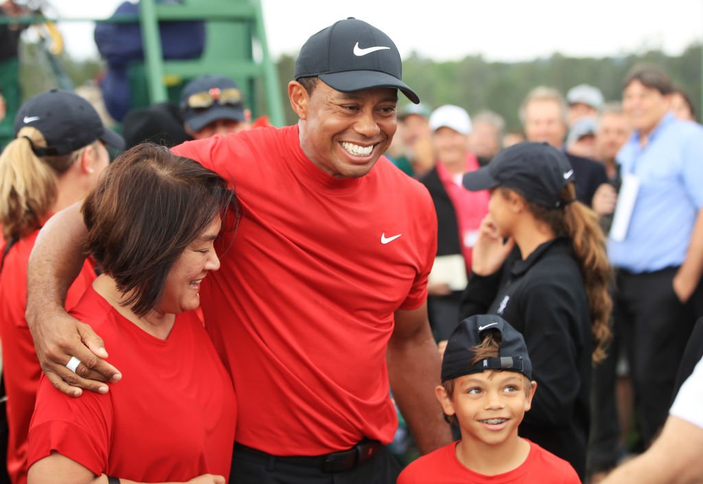 Tiger Woods celebrates with his son Charlie Axel as he comes off the 18th hole in honor of his win during the final round of the Masters on April 14, 2019 in Augusta, Georgia. | Source: Getty Images.