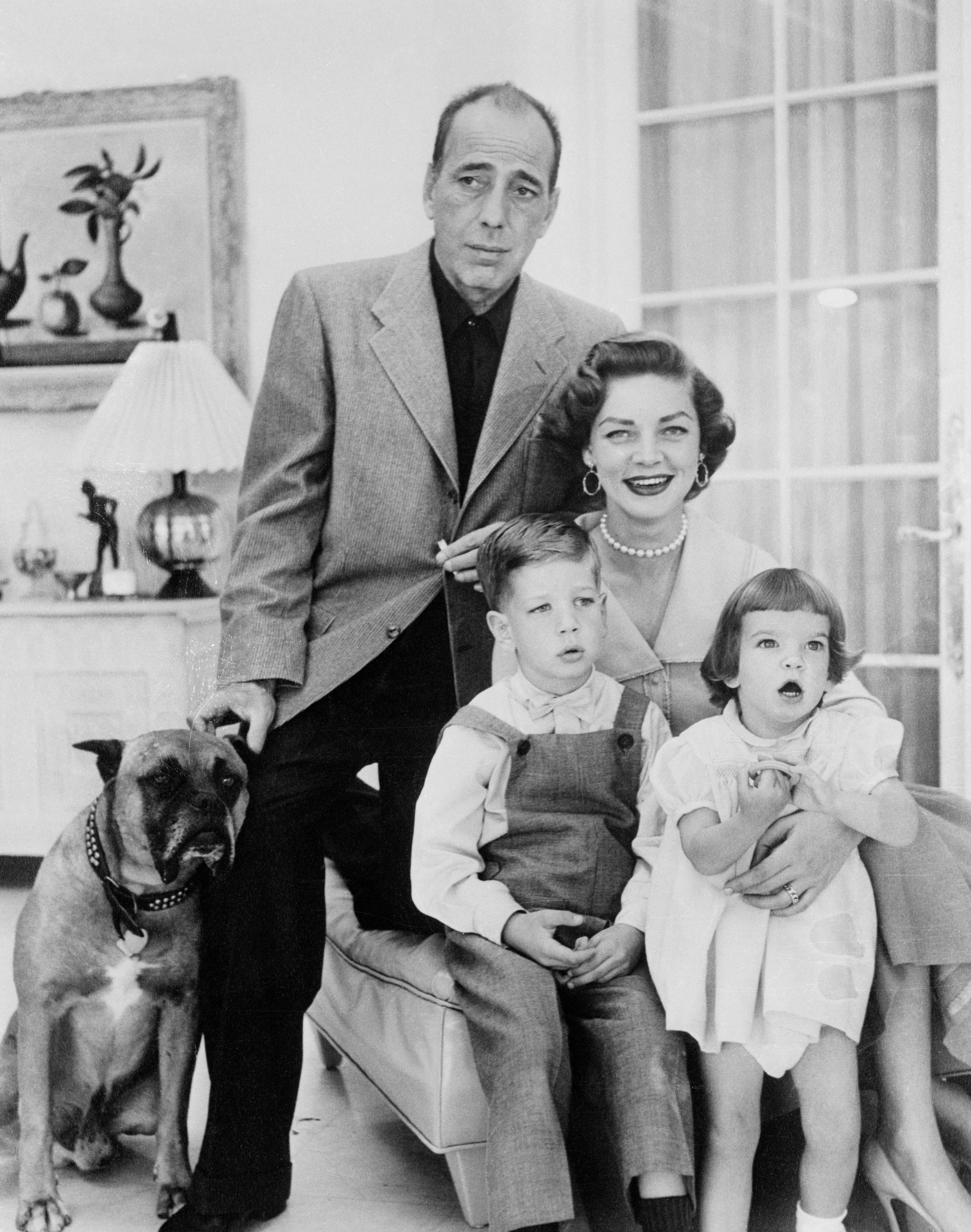 Humphrey Bogart and Lauren Bacall posing for a picture with their children Leslie and Stephen Bolgart on August 4, 1954. | Source: Getty Images