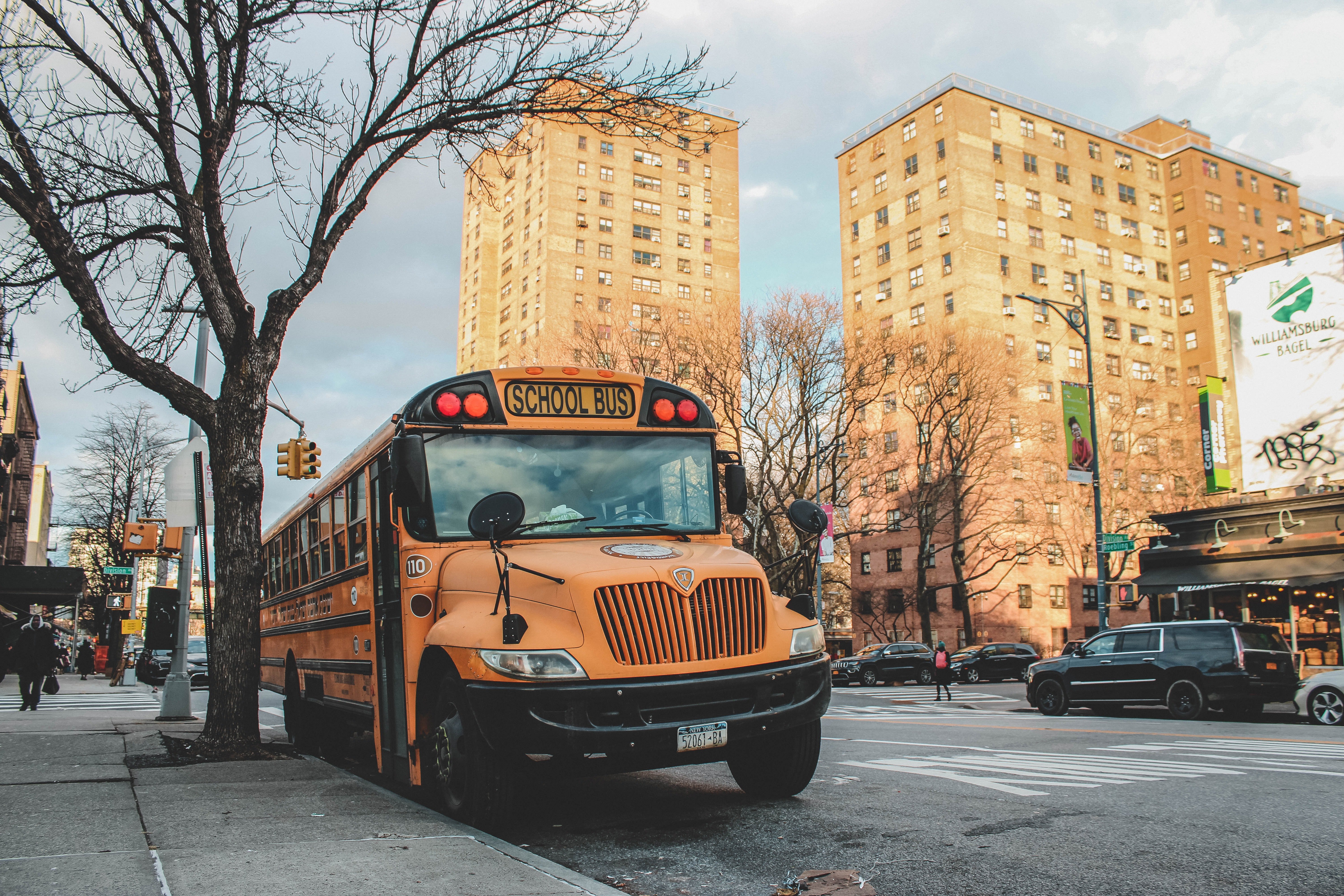 OP was severely condemned for asking a driver to keep a bus full of noisy school kids quiet | Photo: Unsplash  