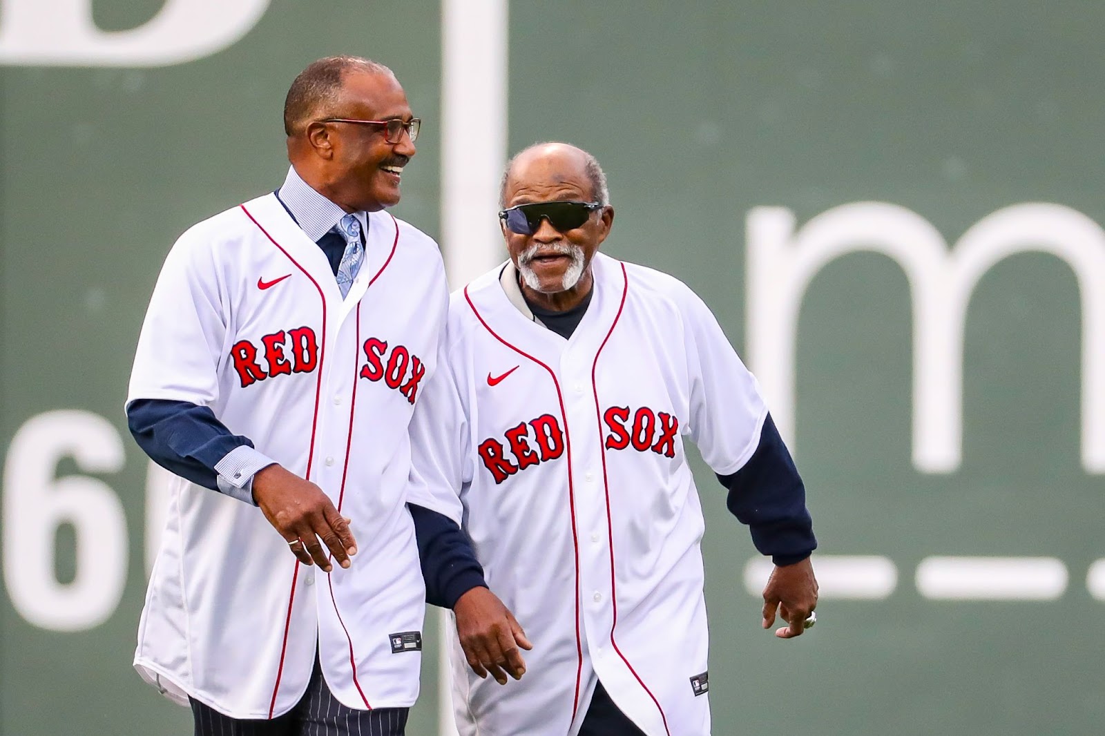 Former Red Sox Jim Rice and Luis Tiant walking onto the field to throw out the ceremonial first pitch for Game 5 of the American League Championship Series on October 20, 2021, in Boston. | Source:  Getty Images