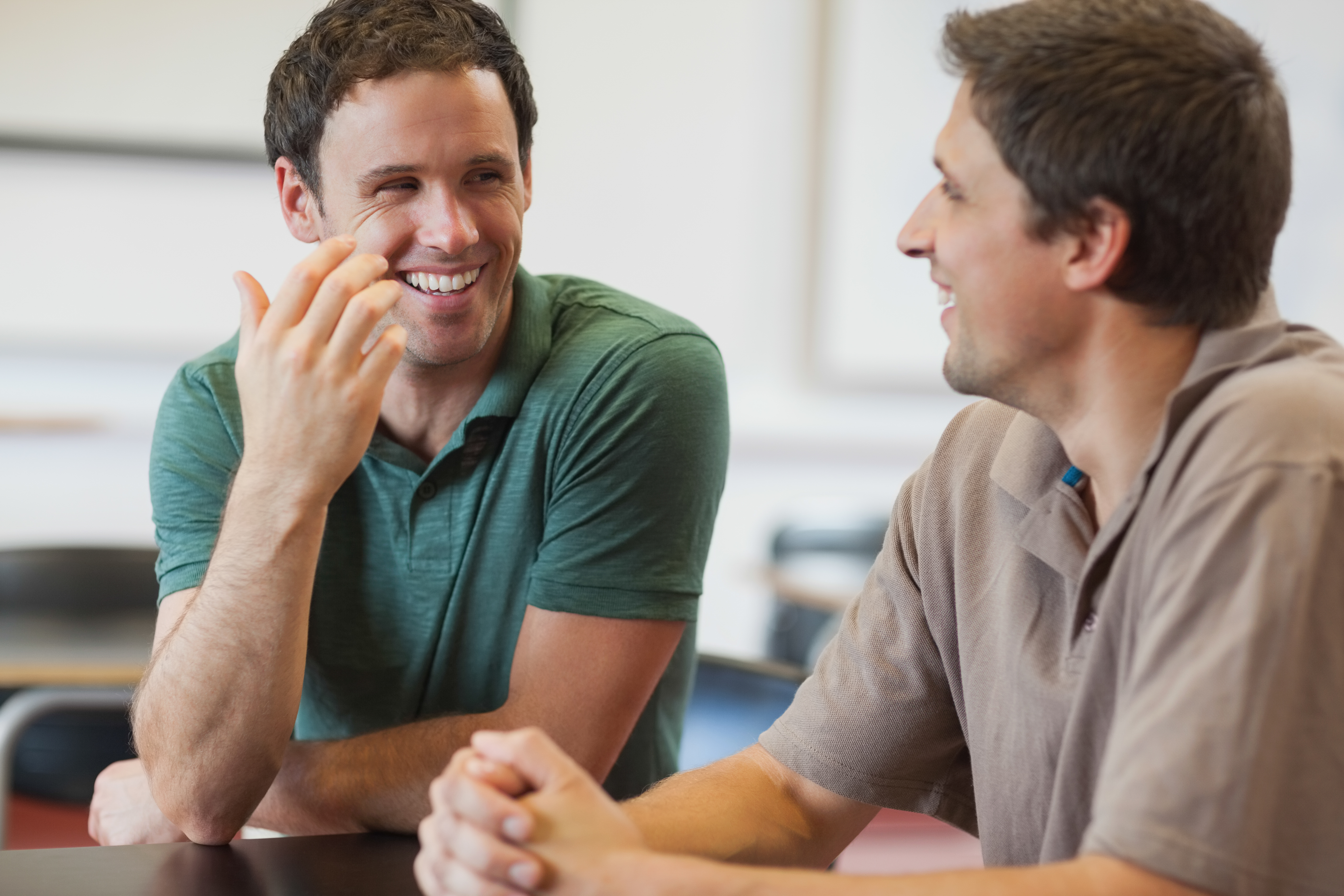 Two men talking | Source: Shutterstock