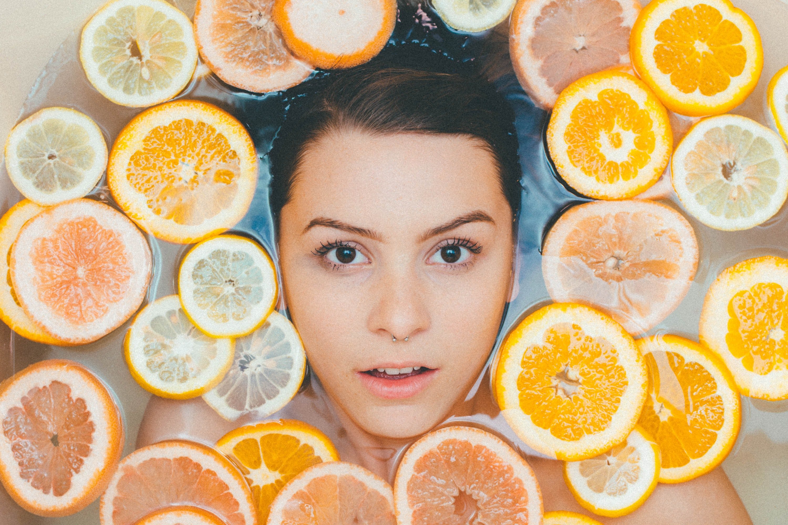 Woman in citrus bath | Unsplash 