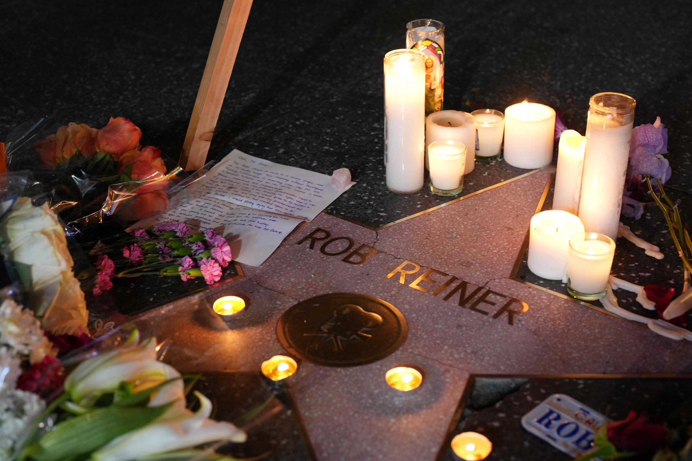 Flowers and candles are placed on director/actor Rob Reiner's Star on the Hollywood Walk of Fame on December 15, 2025 in Los Angeles, California | Source: Getty Images
