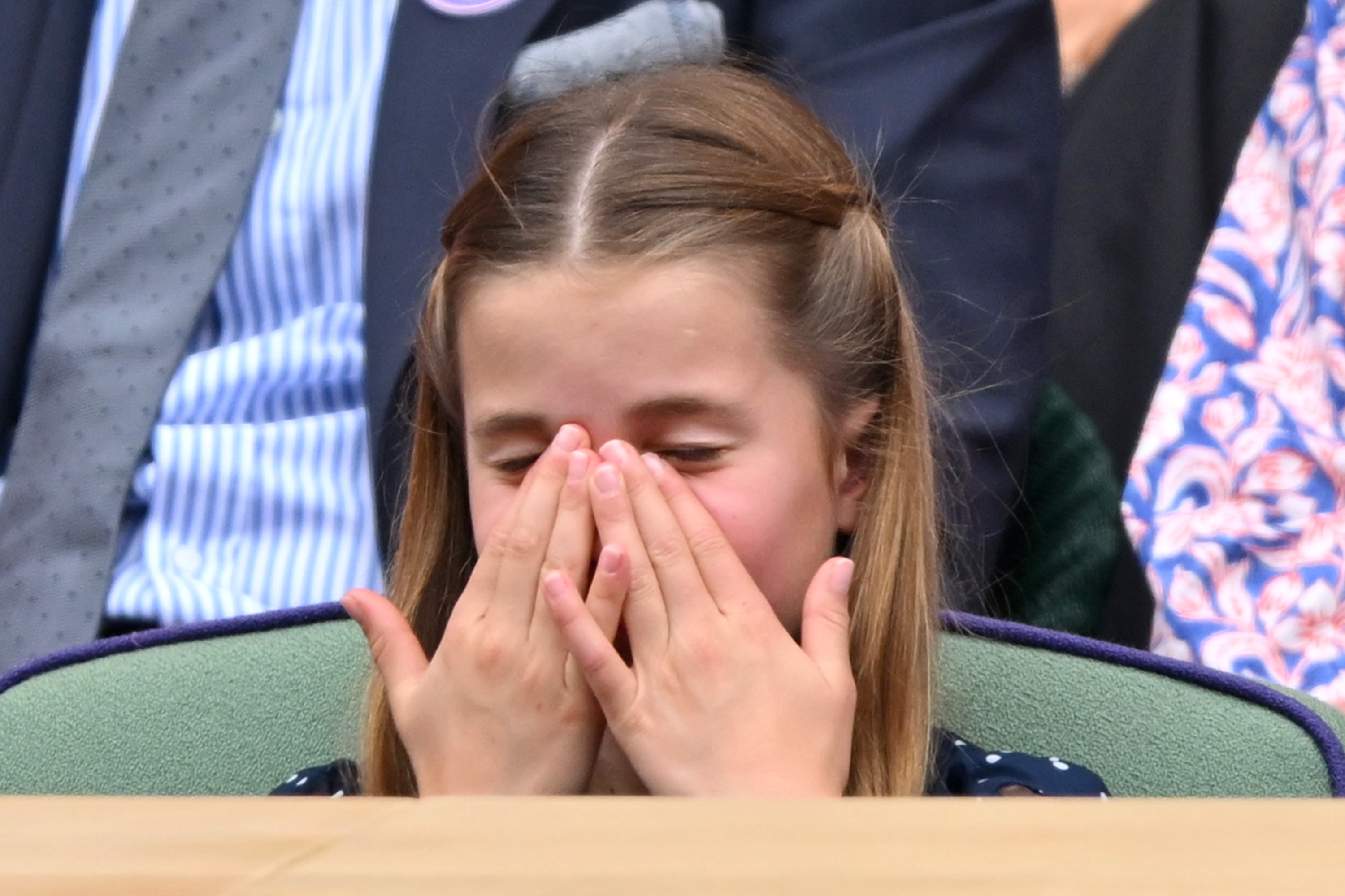 Princess Charlotte feeling the tension while attending the men's finals at Wimbledon in London on July 14, 2024 | Source: Getty Images