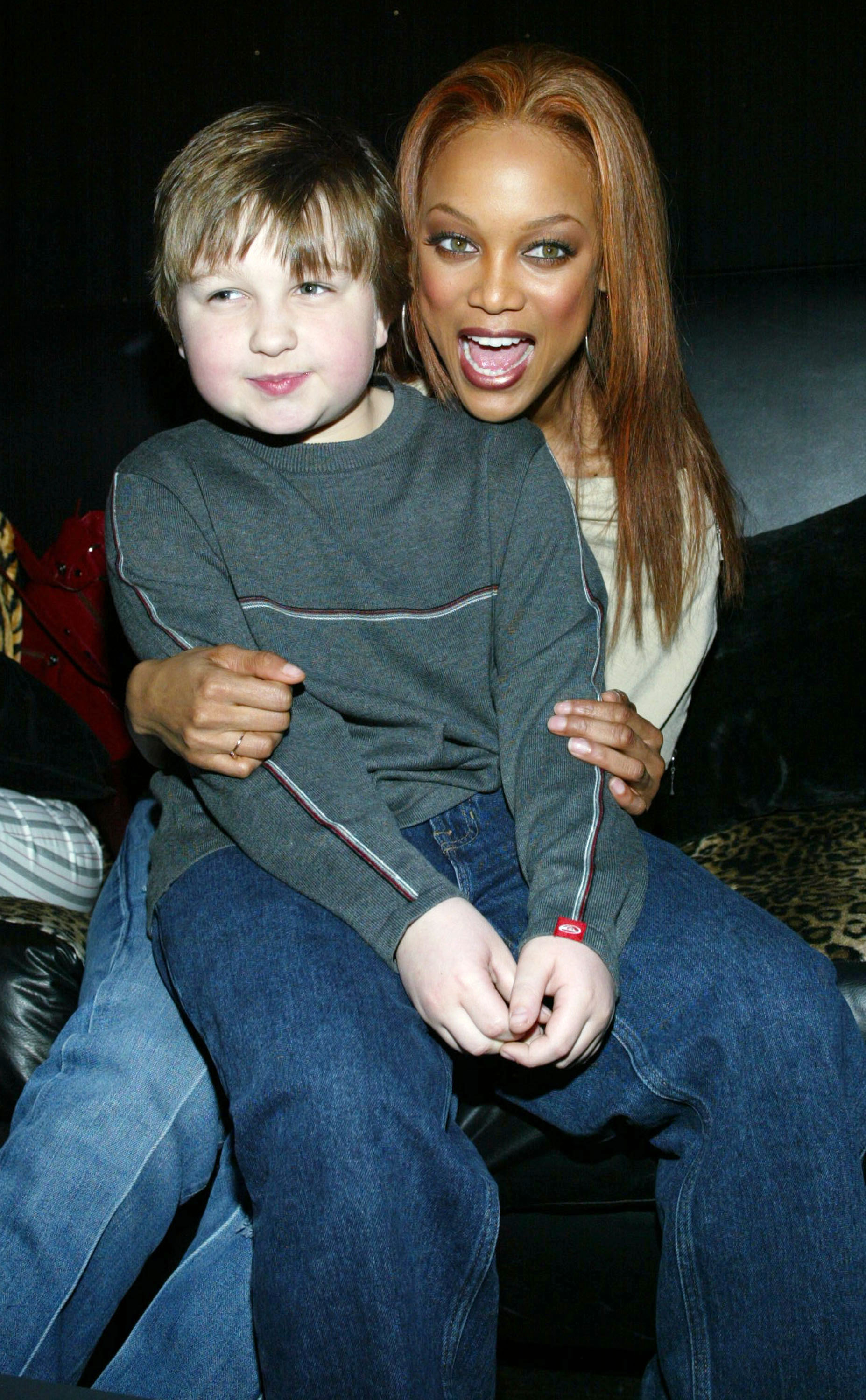 Angus T. Jones and model Tyra Banks in Hollywood in 2004 | Source: Getty Images