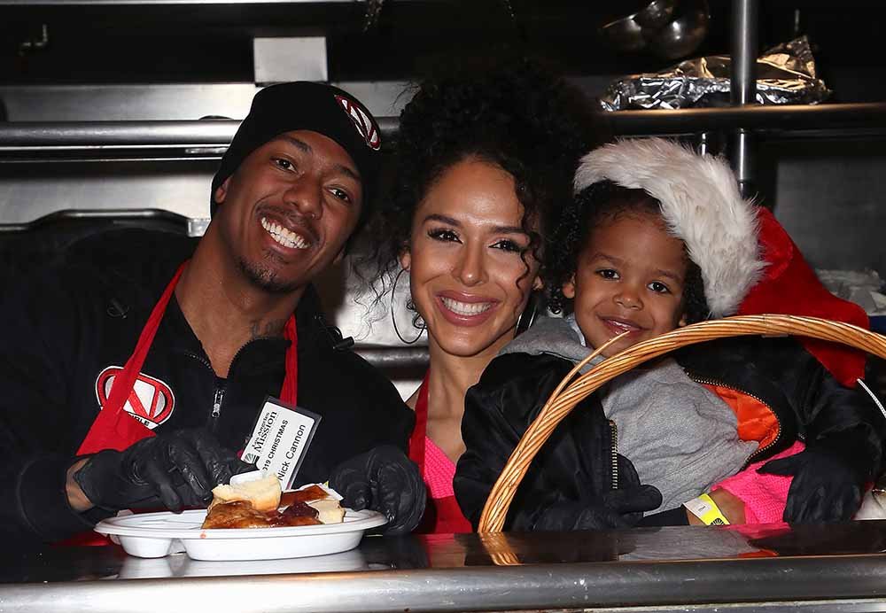 Nick Cannon and Brittany Bell with their son Golden Cannon attending the "Christmas Celebration on Skid Row" at the Los Angeles Mission in December 2019. | Photo: Getty Images