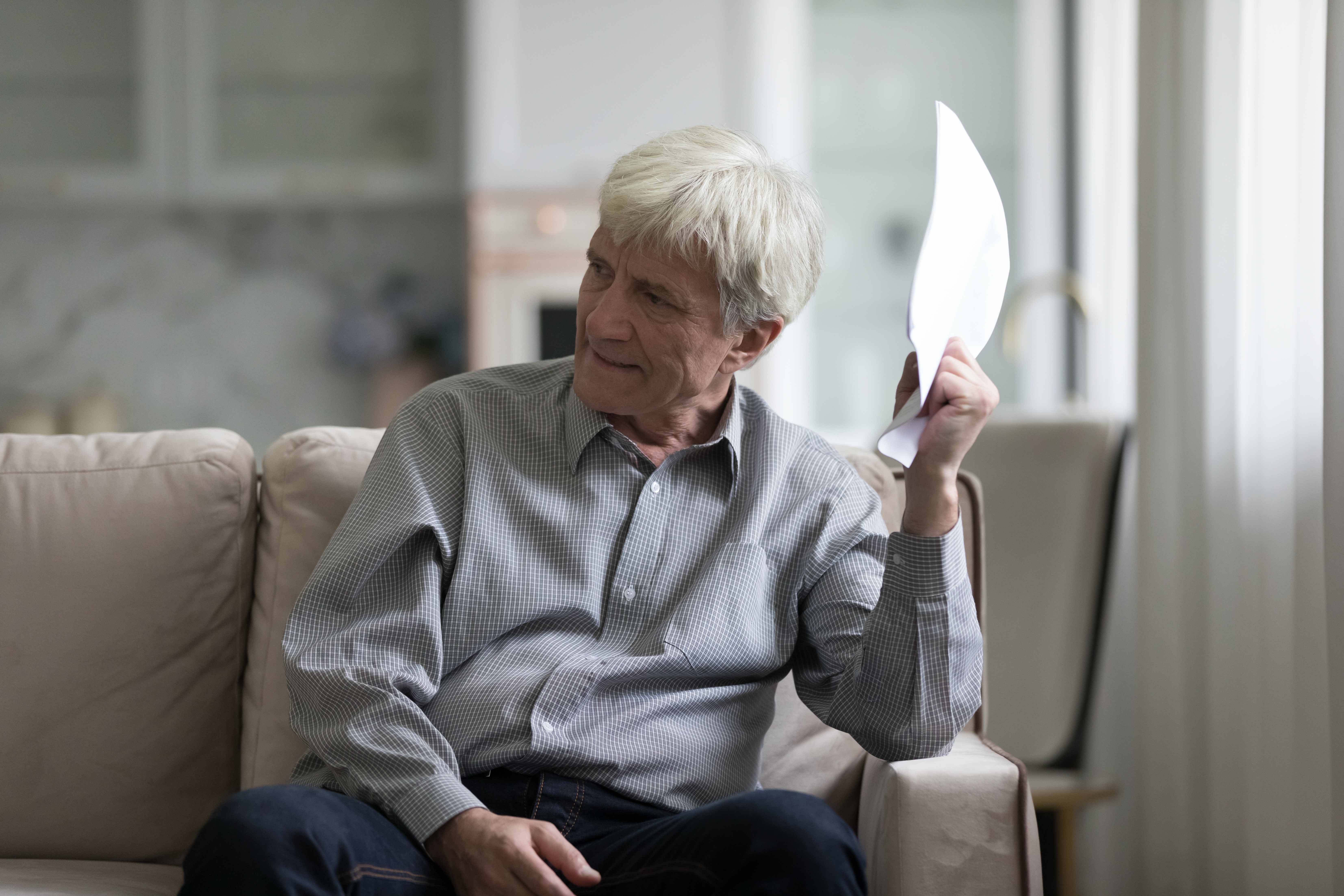 An elderly man looking concerned | Source: Shutterstock