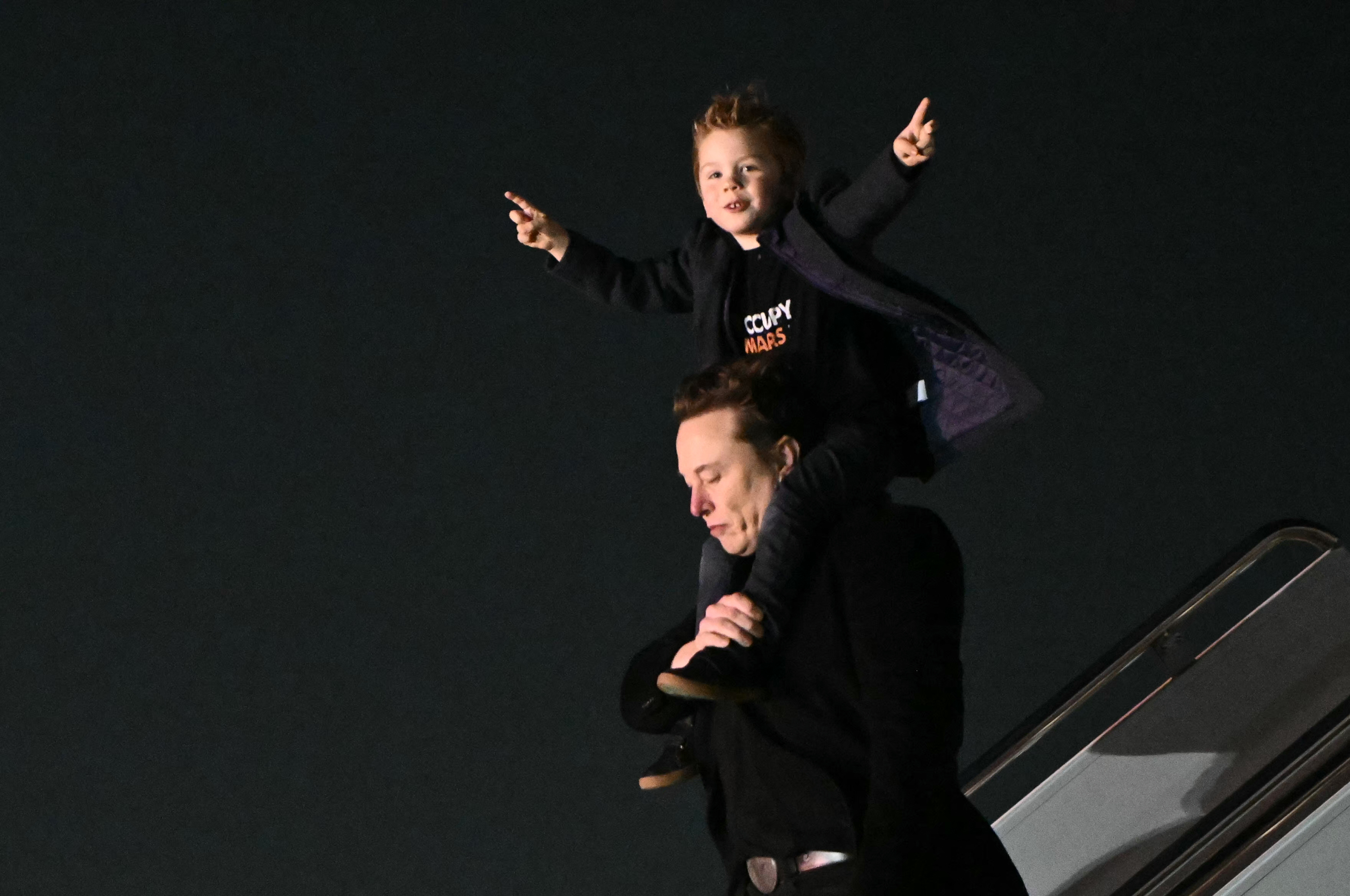 Elon Musk and his son, X Æ A-12, at Miami International Airport on April 12, 2025. | Source: Getty Images