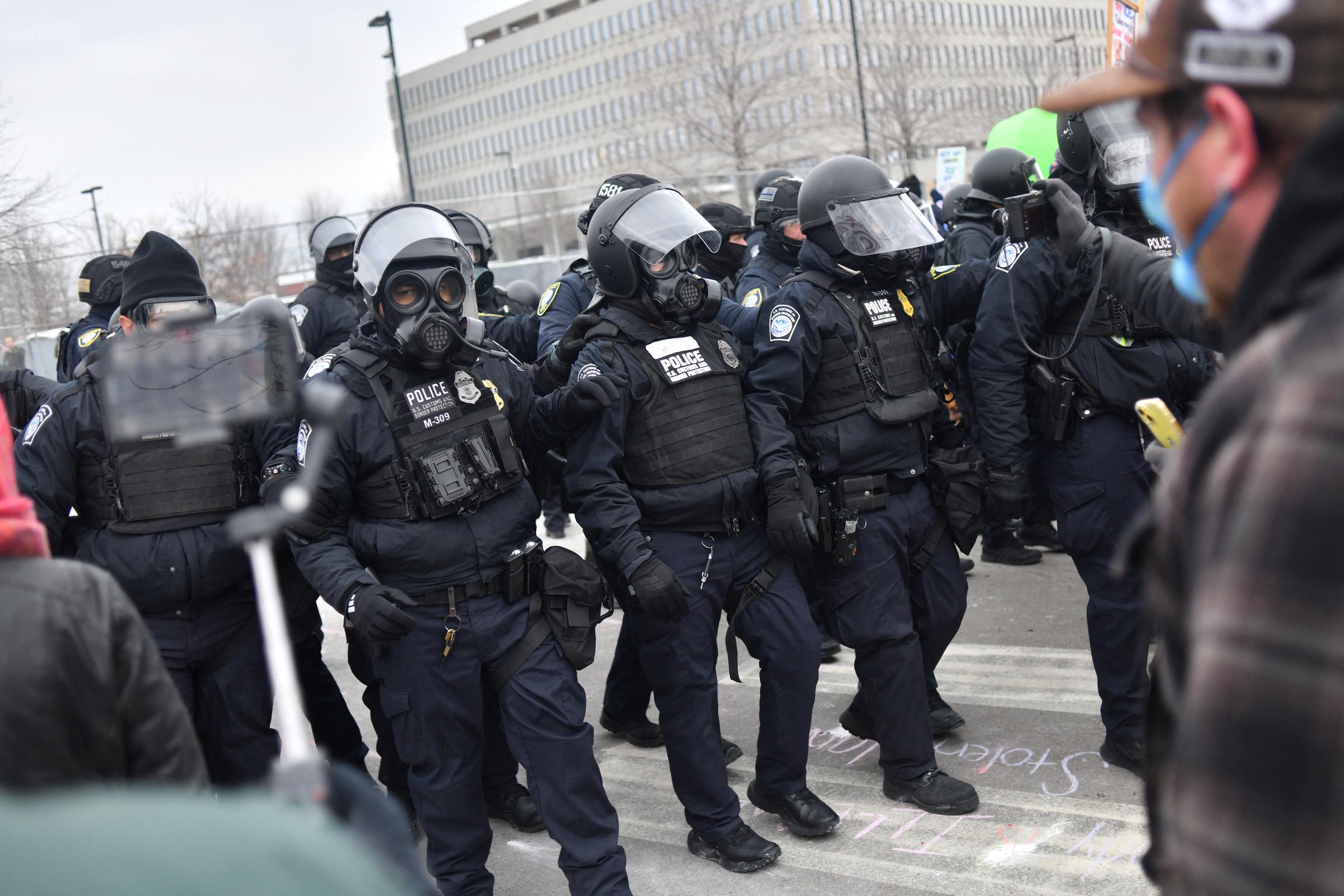 Federal law enforcement agents confront anti-ICE protesters during a demonstration in Minneapolis, Minnesota, on January 15, 2026 | Source: Getty Images