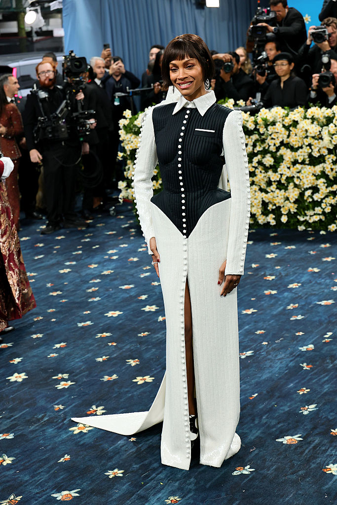 Zoe Saldaña shows off her figure in a monochromatic look at the 2025 Met Gala in New York City.