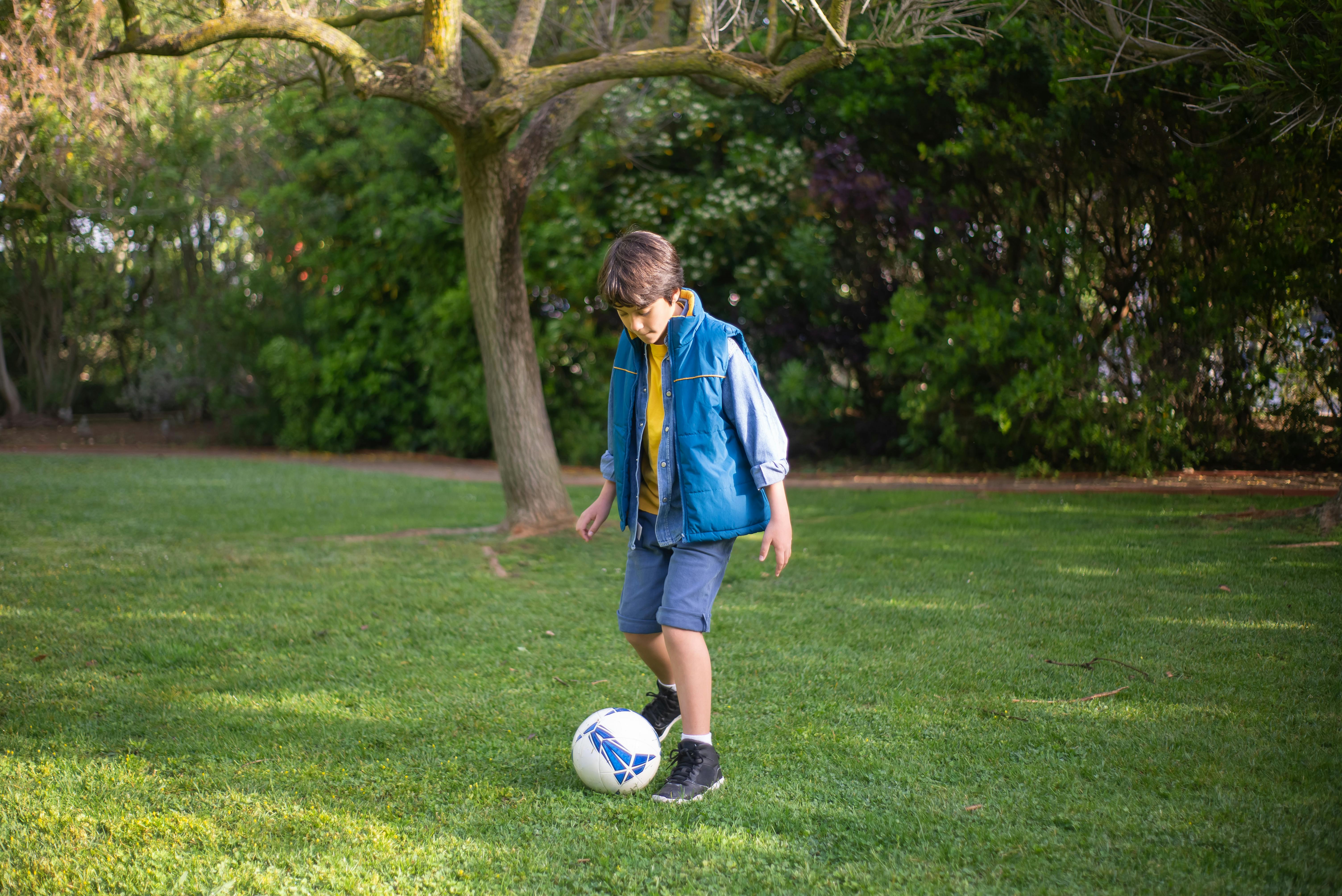 Boy plays soccer | Source: Pexels