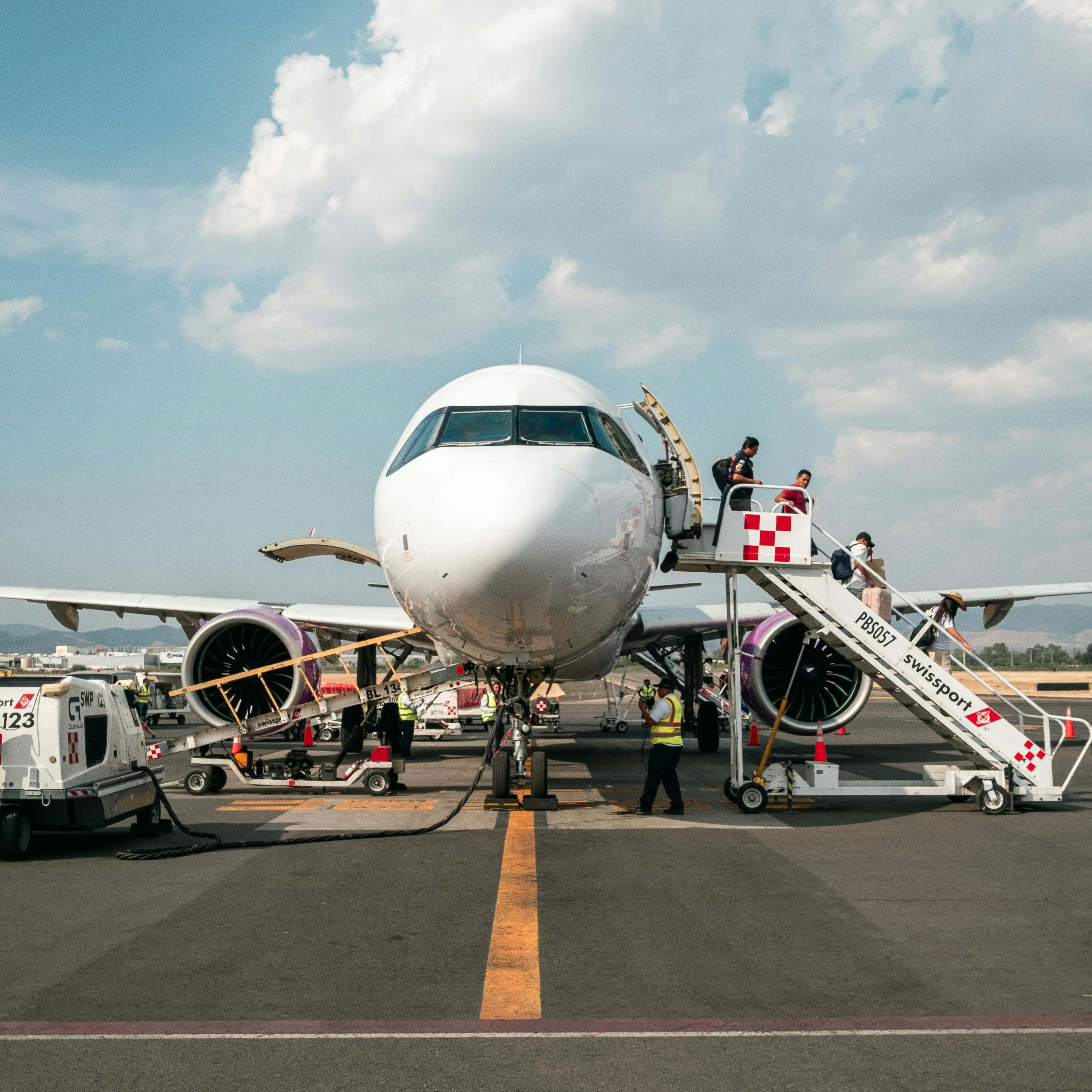 Passengers disembarking from an airplane | Source: Pexels