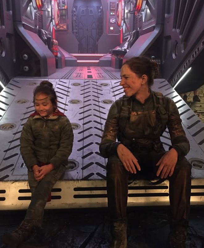 Kaylee Hottle and Rebecca Hall sit together on a set resembling a futuristic spacecraft during production of a "Godzilla" film. Rebecca shared a behind-the-scenes photo while remembering her young co-star after the co-star's death. | Source: Instagram/rebeccahall