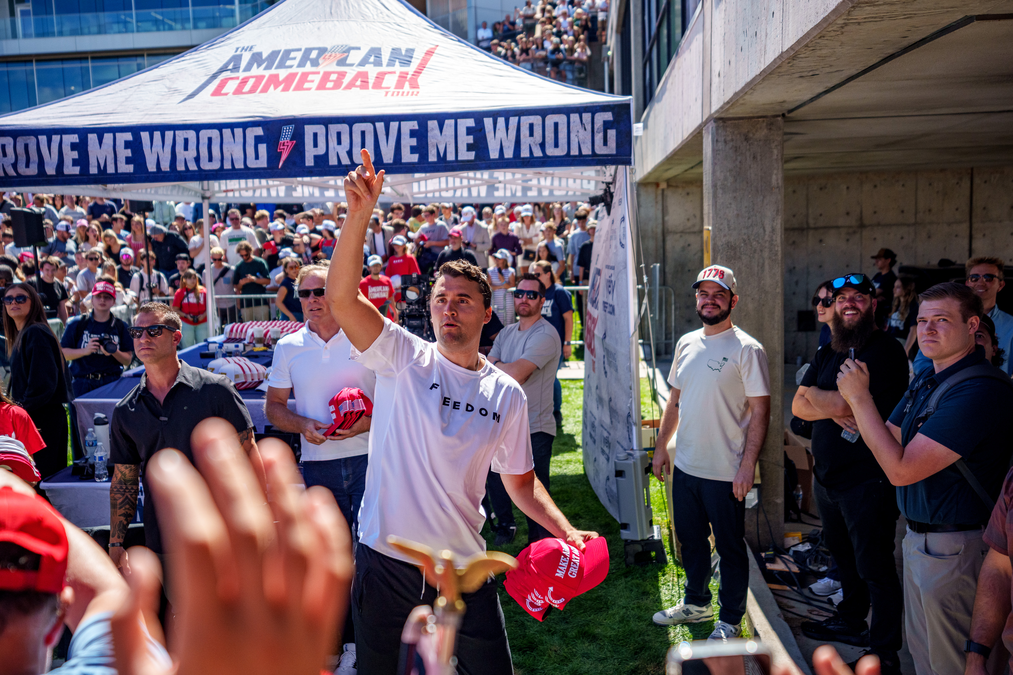 Charlie Kirk throws hats to the crowd at Utah Valley University on September 10, 2025 | Source: Getty Images