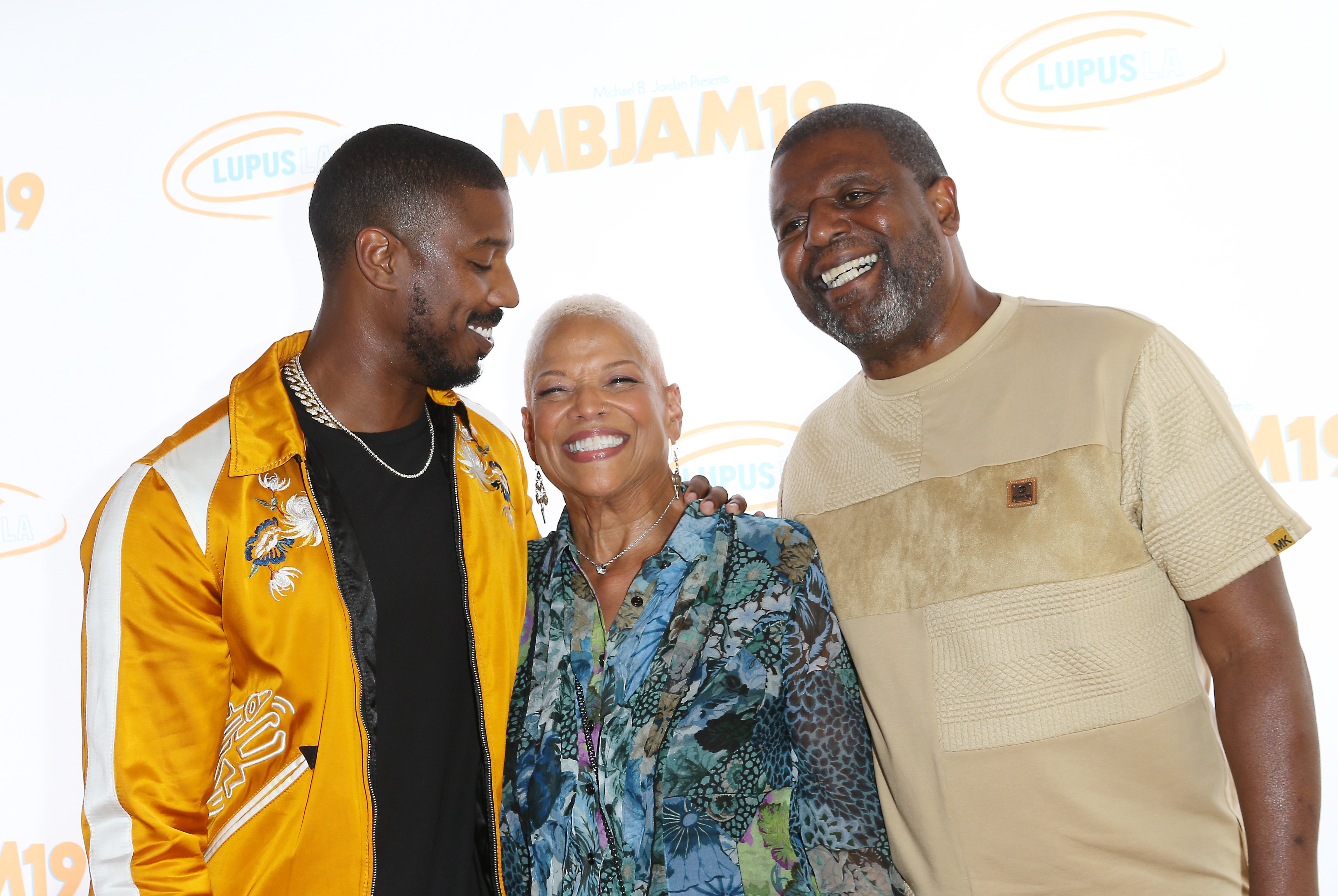 Michael B. Jordan with his parents, Donna Jordan and Michael A. Jordan attending the Lupus LA presents - 3rd Annual MBJAM19 held at Dave & Busters on July 27, 2019 in Hollywood, California. | Source: Getty Images