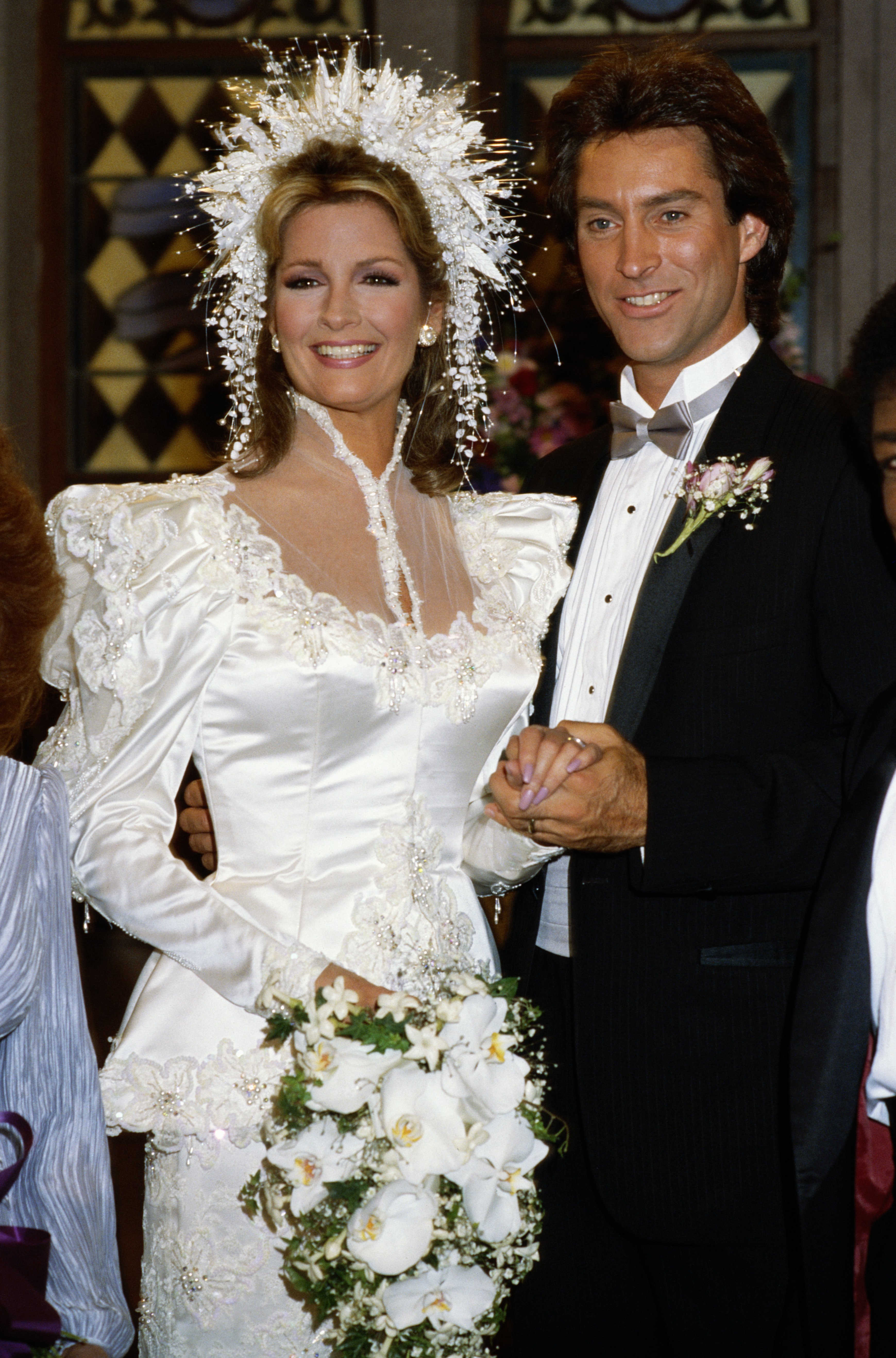 Actress Deidre Hall starring as Dr. Marlena Evans with actor Drake Hogestyn as John Black in a wedding scene from the soap opera "Days of Our Lives," on January 1, 2005 ┃Source: Getty Images
