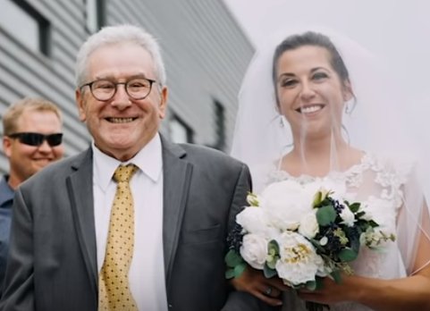 Jim Stamp with the bride, his daughter Gina. | Source: YouTube/GMA