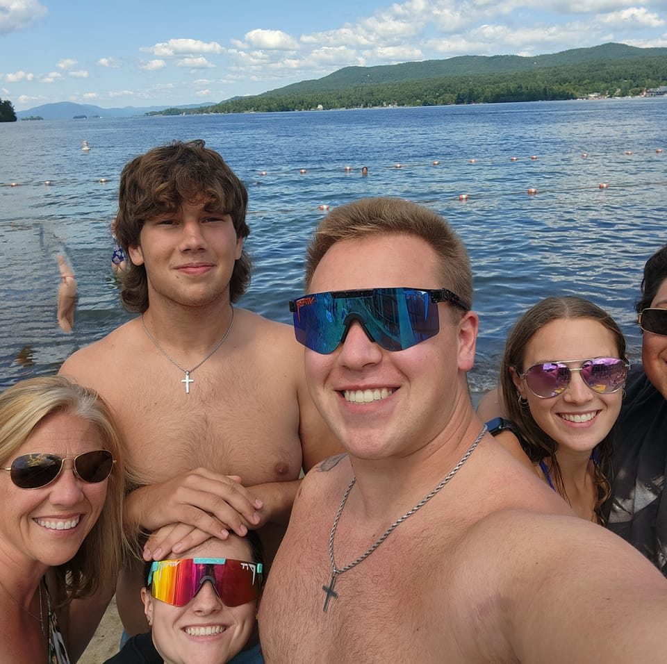 The Dorgan family gathers for a lakeside outing in a family snapshot shared prior to the Rhode Island hockey incident | Source: Facebook/rhonda.dorgan