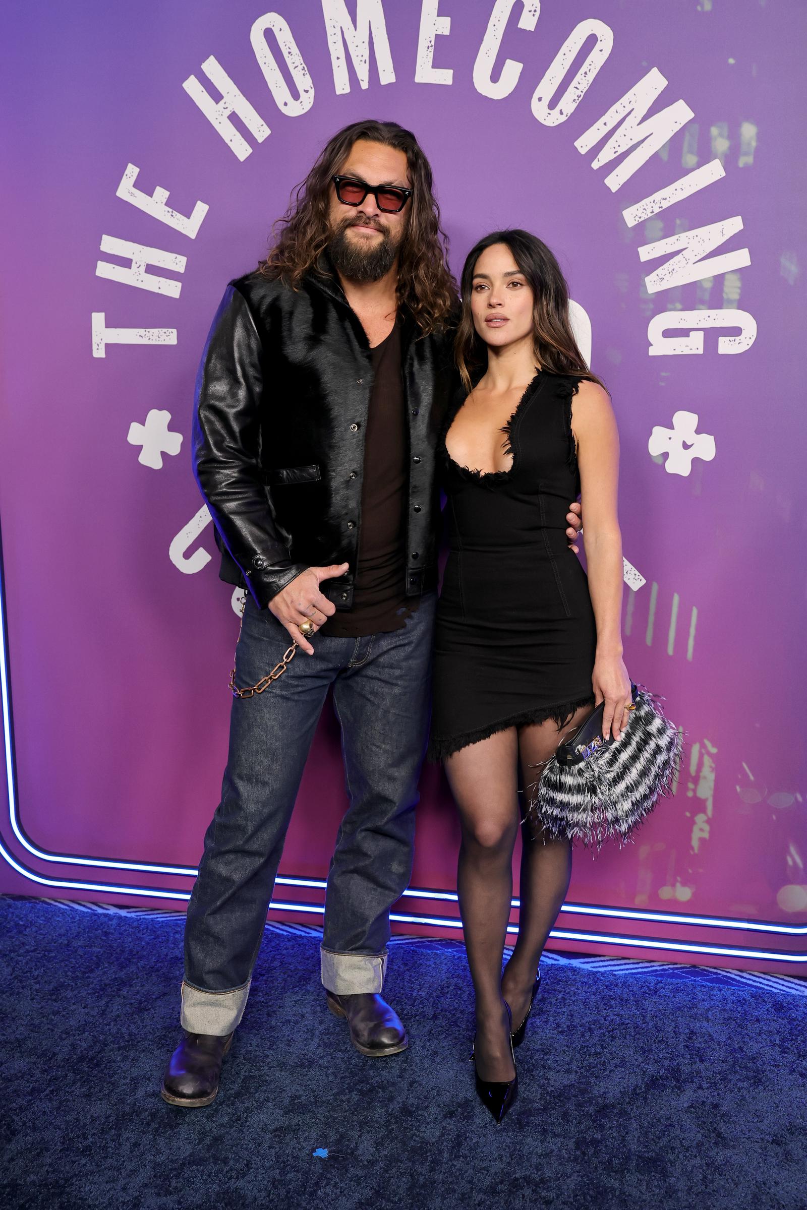 Jason Momoa and Adria Arjona attend the "SNL50: The Homecoming Concert" at Radio City Music Hall on February 14, 2025, in New York | Source: Getty Images