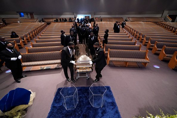 The casket bearing the remains of George Floyd is brought into the chapel for his funeral service at the Fountain of Praise church June 9, 2020 in Houston, Texas | Photo: Getty Images