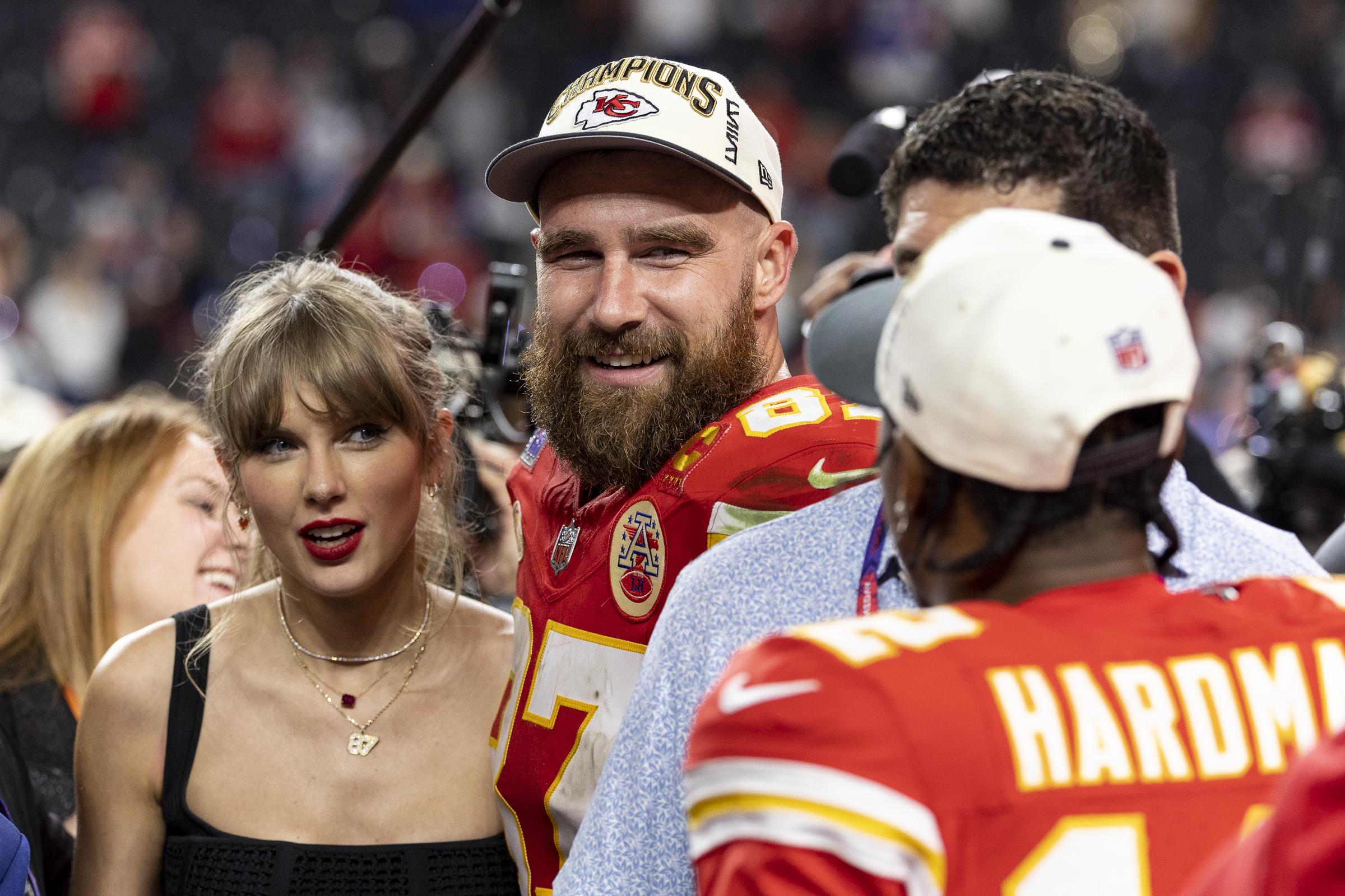 Taylor Swift and Travis Kelce react as they see Mecole Hardman Jr. following the NFL Super Bowl 58 football game on February 11, 2024, in Las Vegas, Nevada. | Source: Getty Images