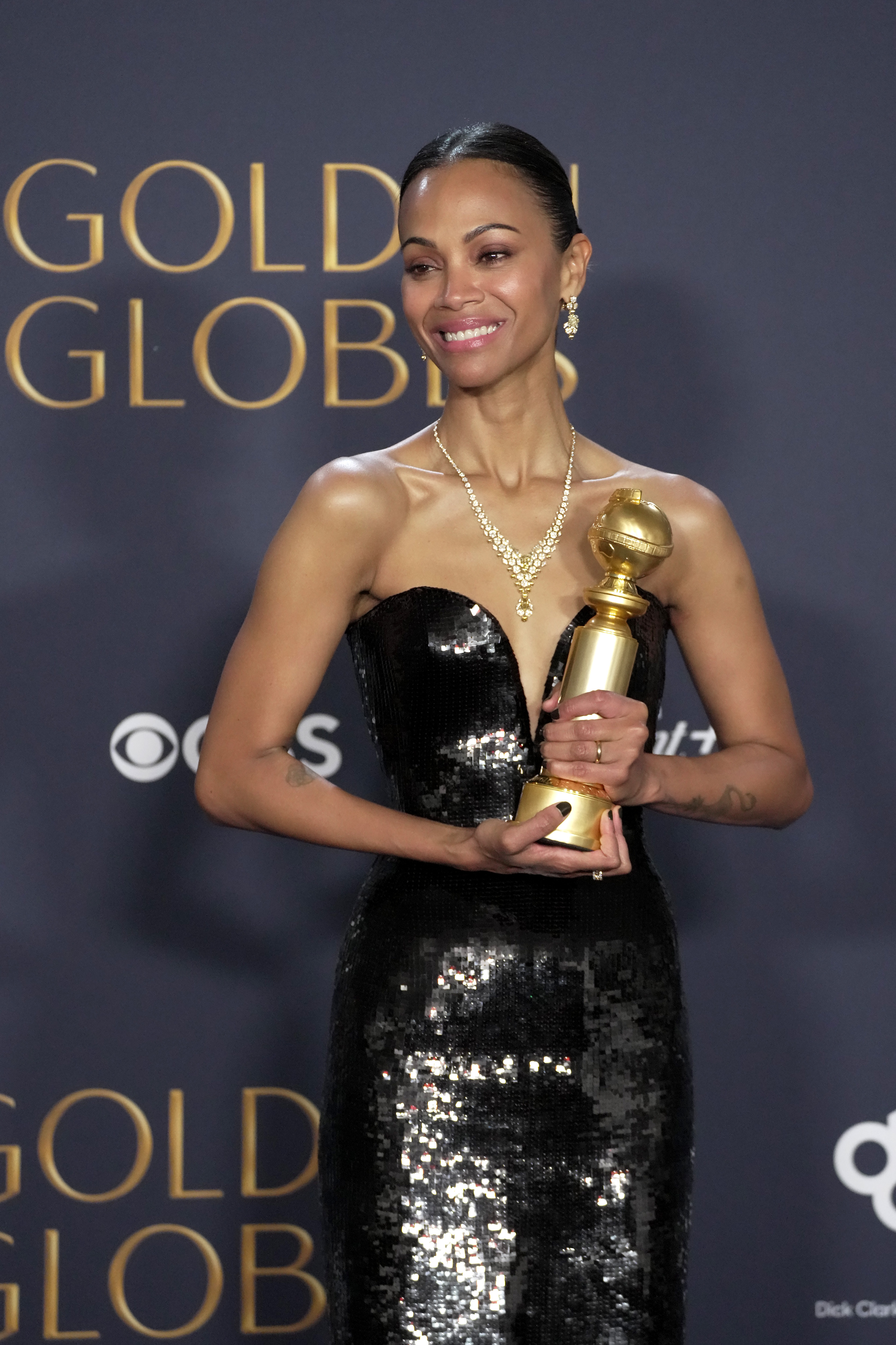 Zoe Saldana poses in the press room at the 82nd Annual Golden Globe Awards at The Beverly Hilton in Beverly Hills, California, on January 5, 2025 | Source: Getty Images