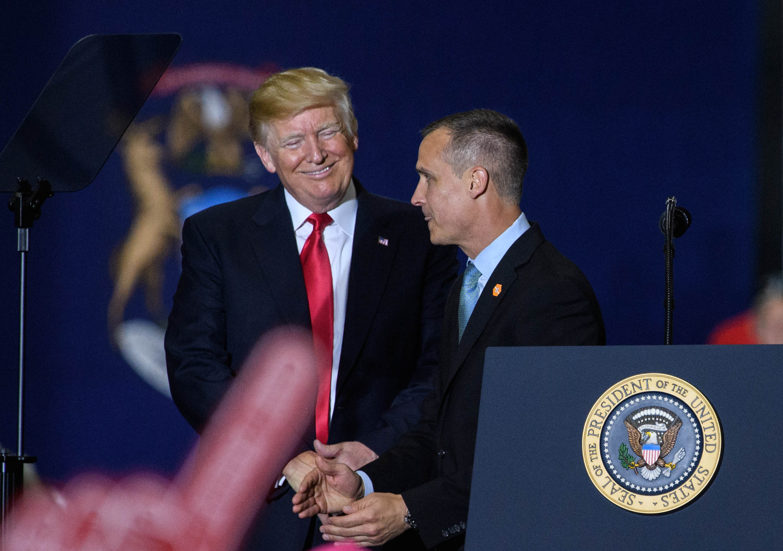 U.S. President Donald Trump smiles at Corey Lewandowski during a rally in Washington, D.C., on April 28, 2018. | Source: Getty Images