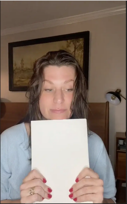 Megan Kennedy reading the letter | Source: Tiktok/@megan4hand