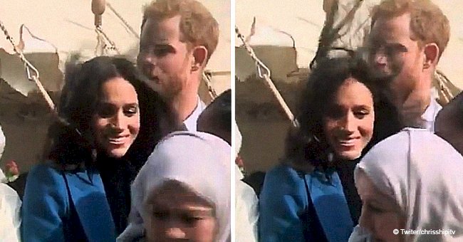 Prince Harry fixes Meghan Markle's hair after the wind messes it up