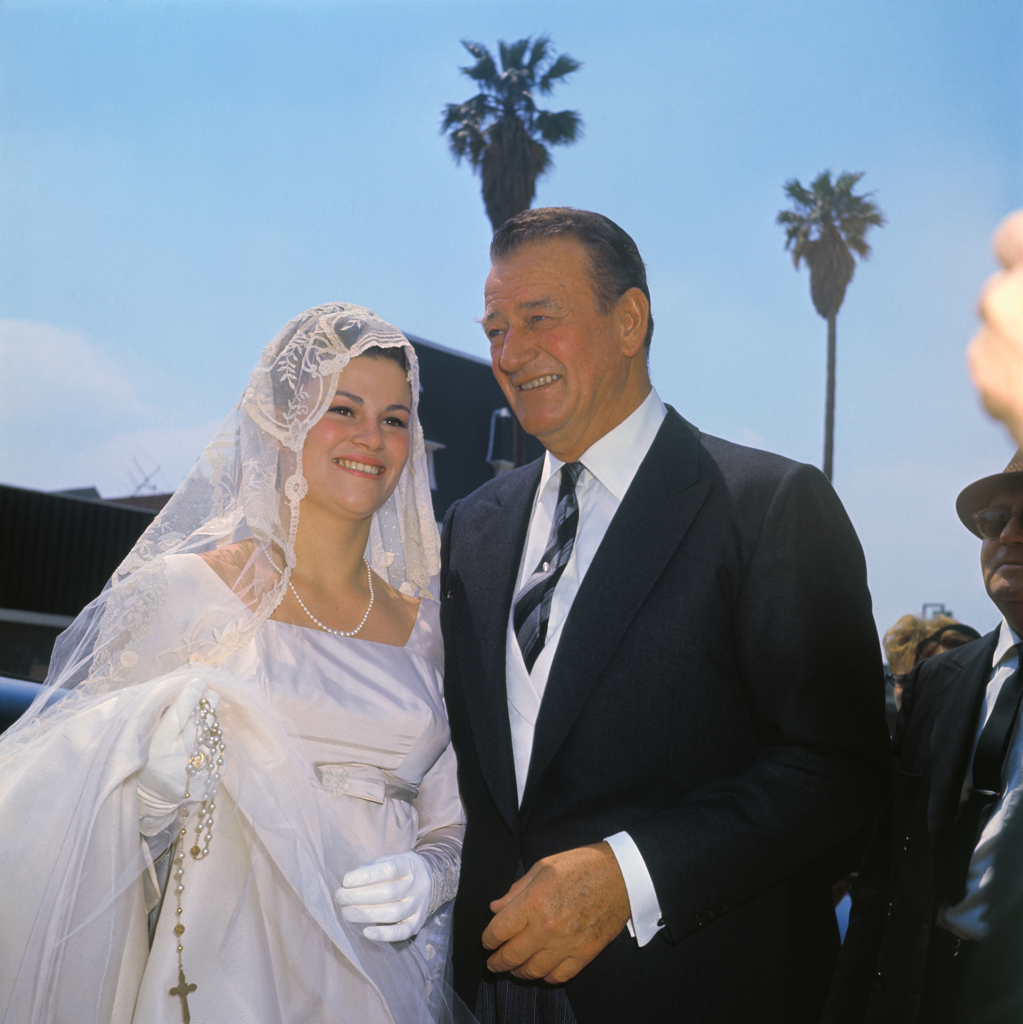John Wayne with his daughter, Melinda Ann, on her wedding day to Gregory Robert Munoz on April 4, 1964 | Source: Getty Images