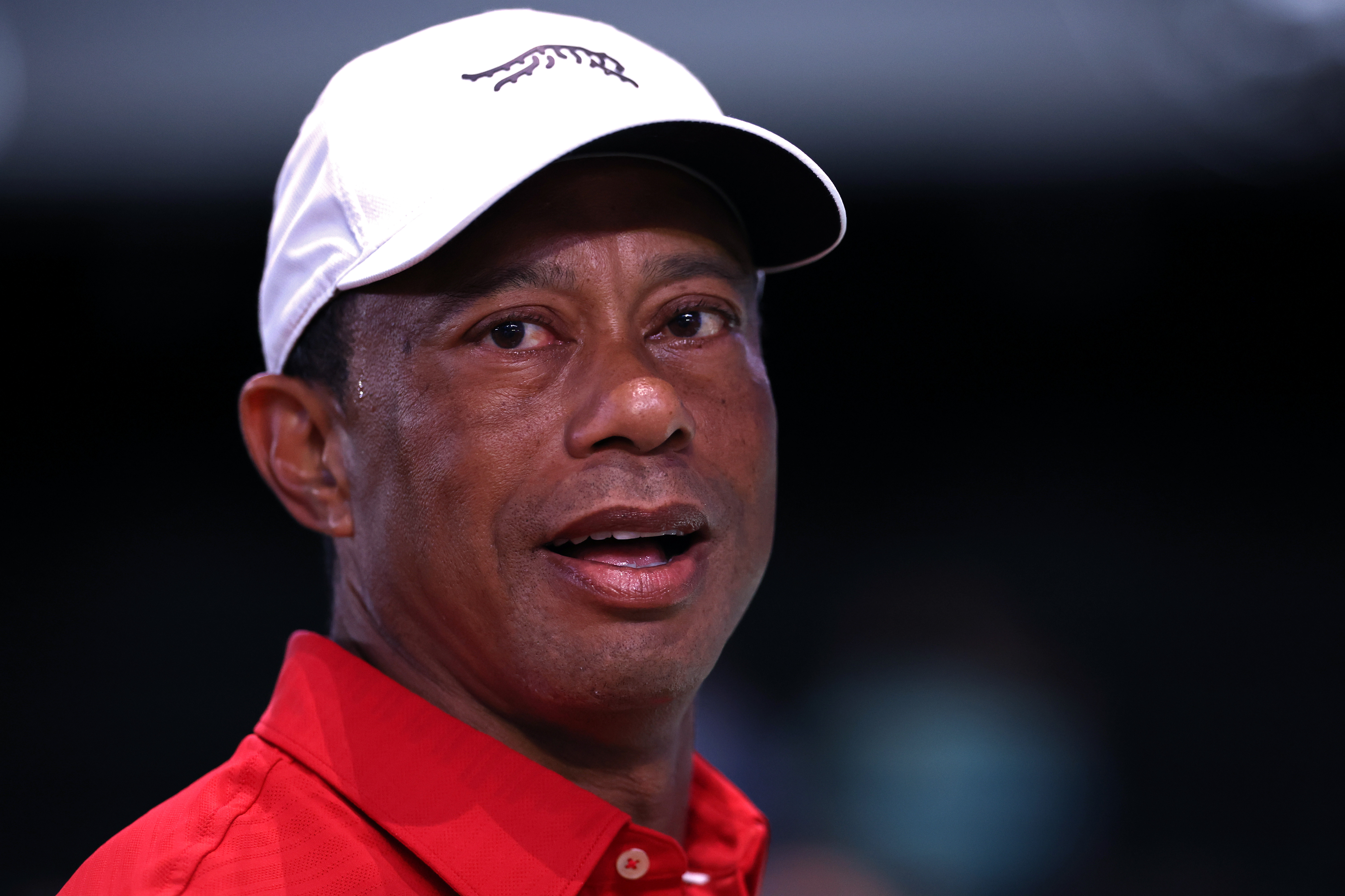 Tiger Woods mid-expression during the game against the Los Angeles Golf Club at SoFi Center. | Source: Getty Images