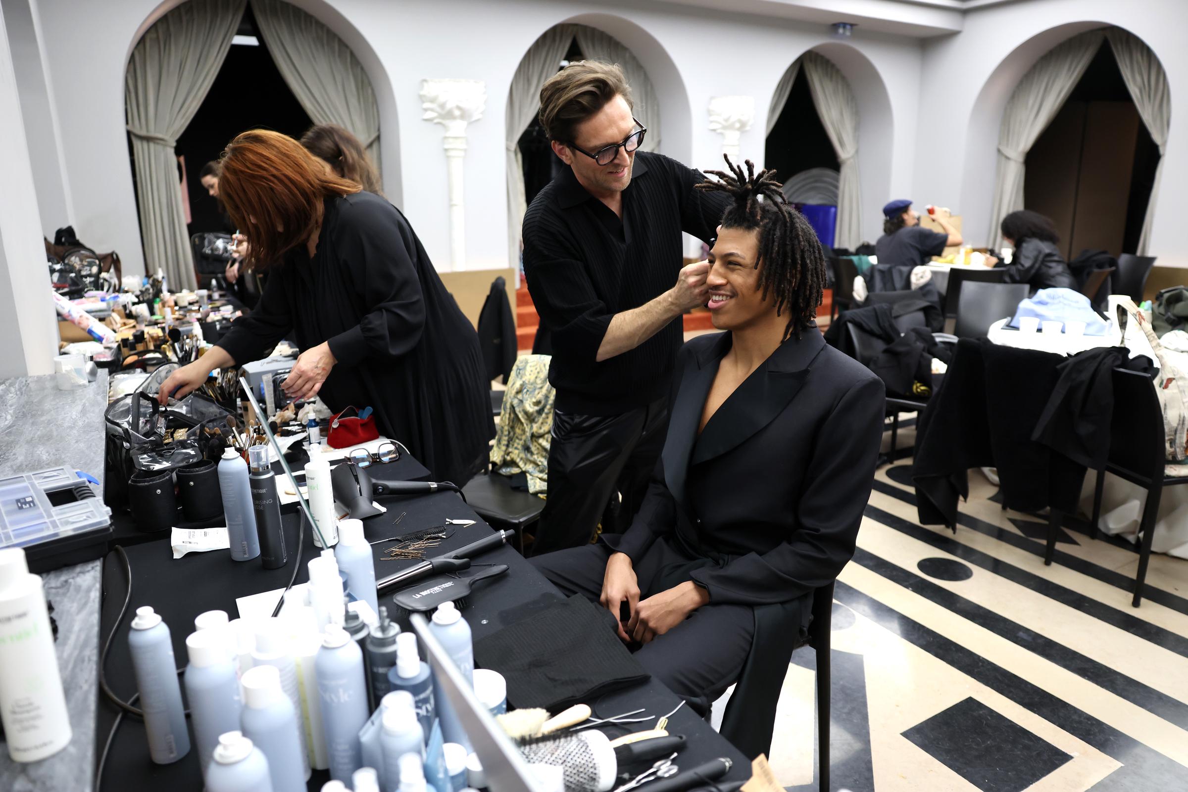 Henry Samuel prepares backstage at Paris Fashion Week | Source: Getty Images