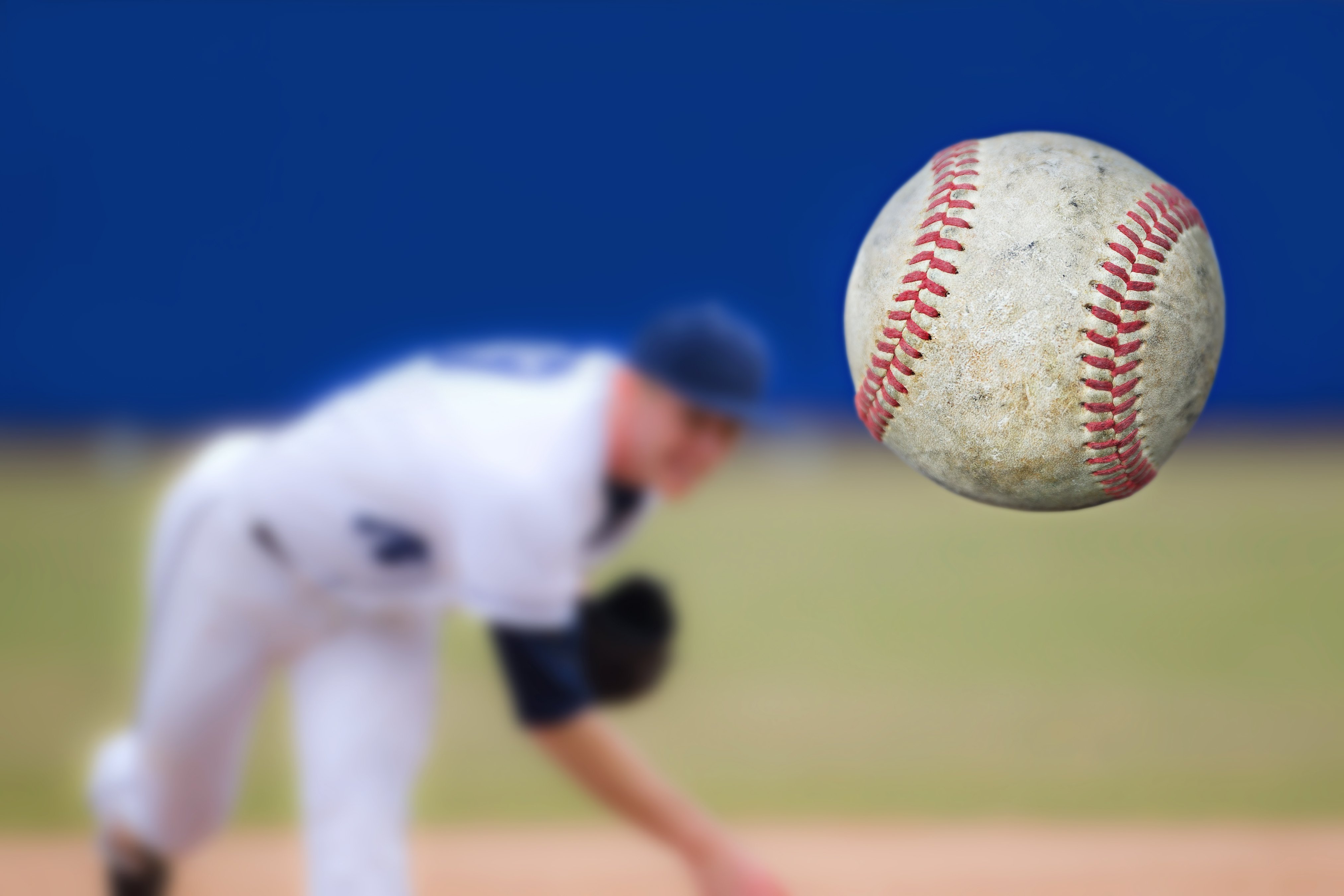 Baseball Pitcher throwing ball | Photo: Shutterstock 