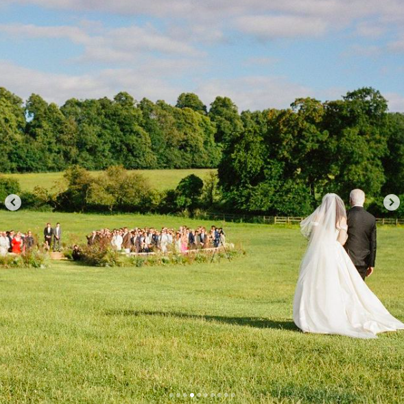 Jesse Light being walked down the aisle by her dad during her five-day wedding celebration, posted on July 15, 2024 | Source: Instagram/vogueweddings