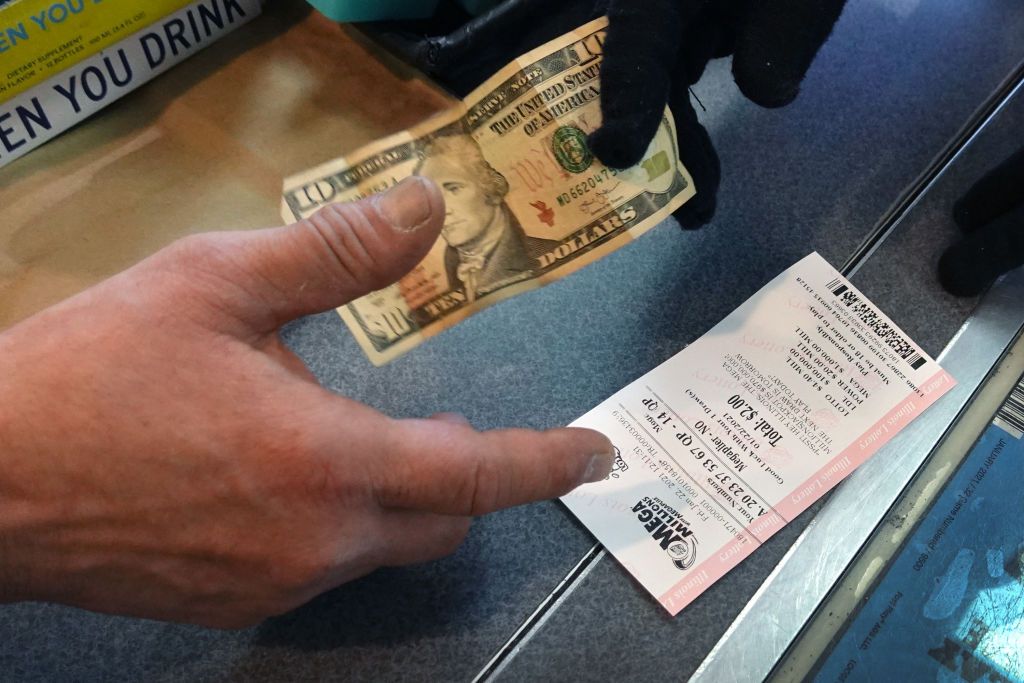 A man purchasing a lottery ticket at a 7-Eleven store in the Loop on January 22, 2021 in Chicago, Illinois. | Source: Getty Images