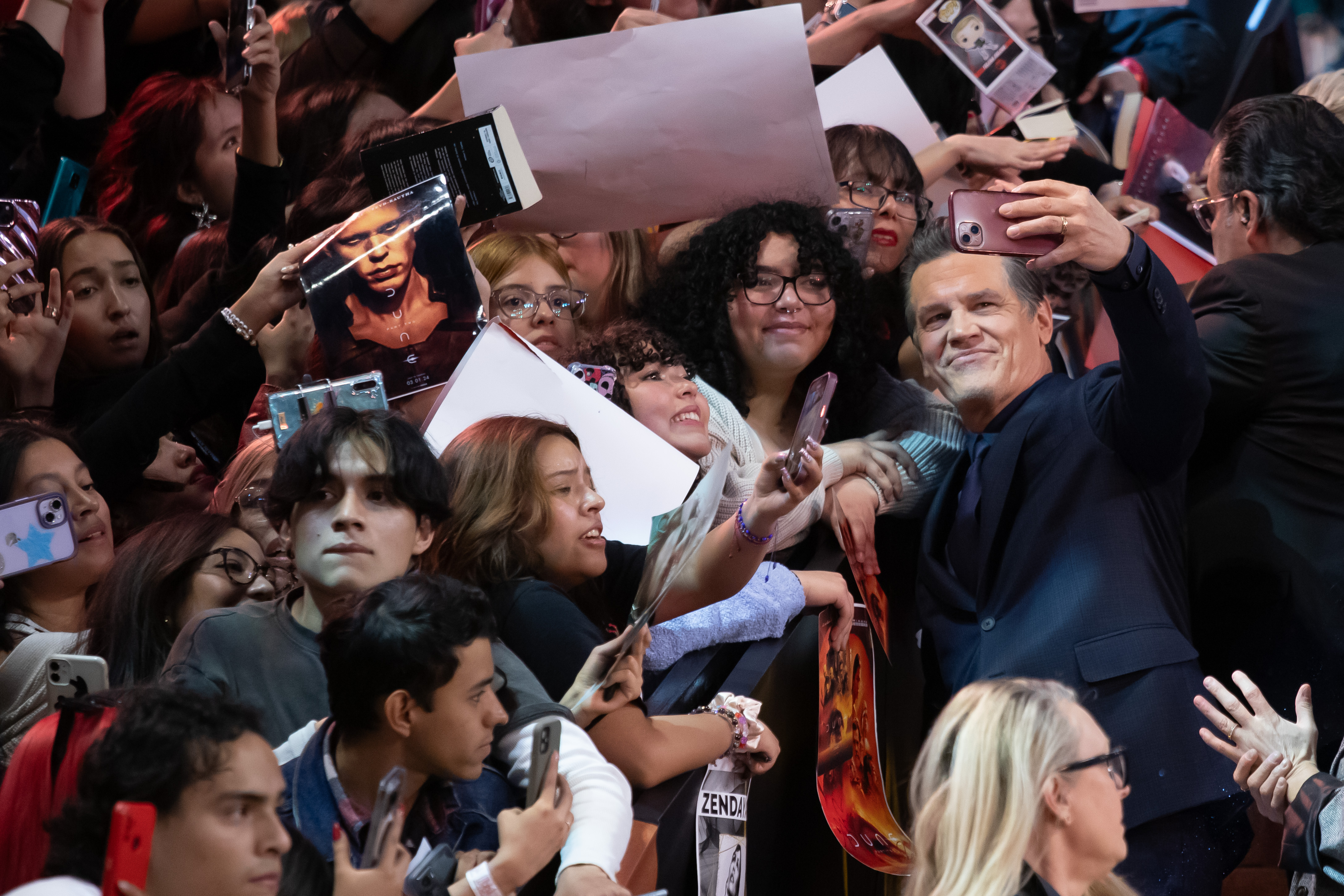 Josh Brolin takes a selfie with fans on the red carpet for "Dune: Part Two" at Auditorio Nacional in Mexico City on February 6, 2024 | Source: Getty Images