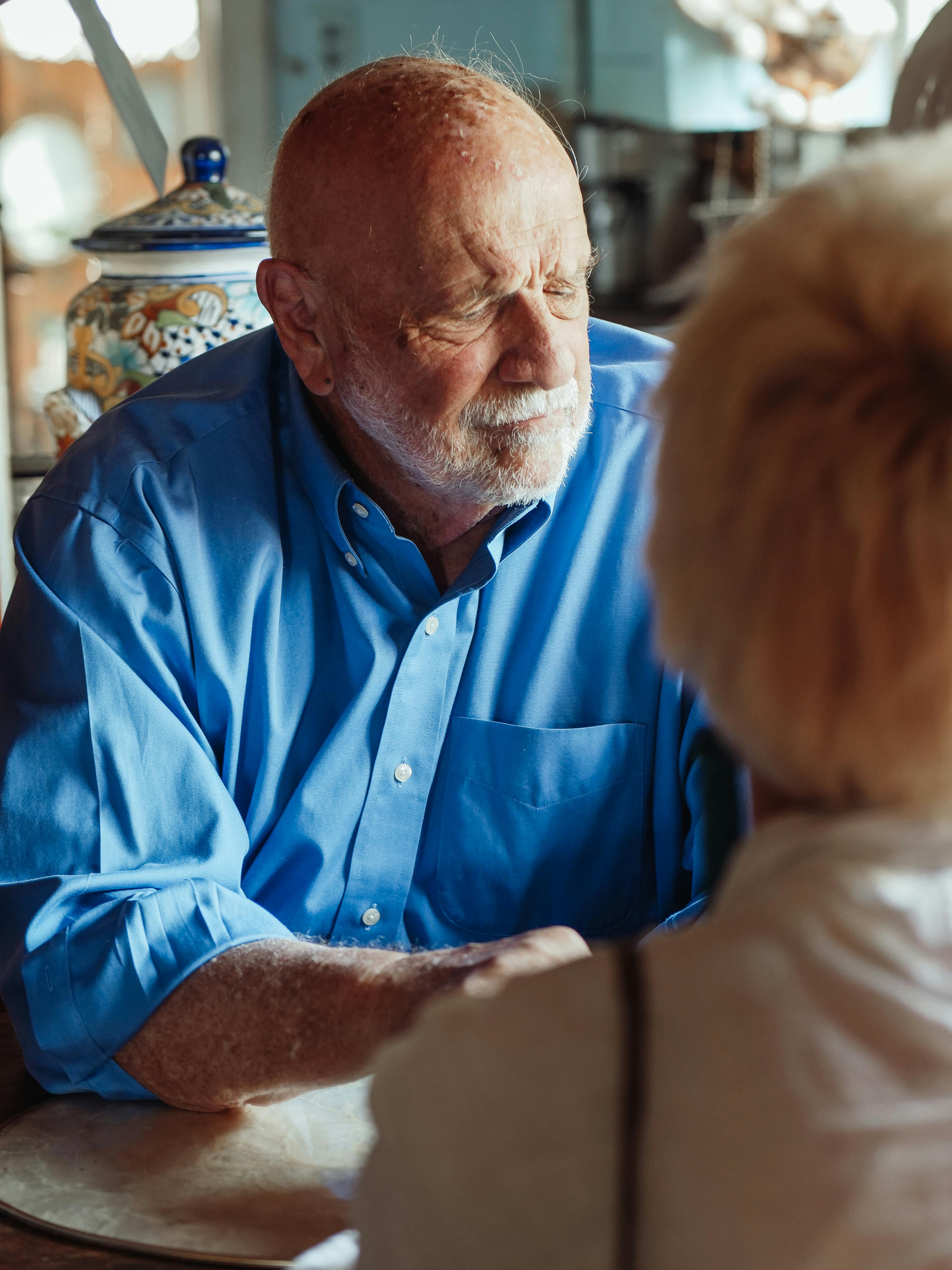 A older man seated, with a sad expression on his face | Source: Pexels